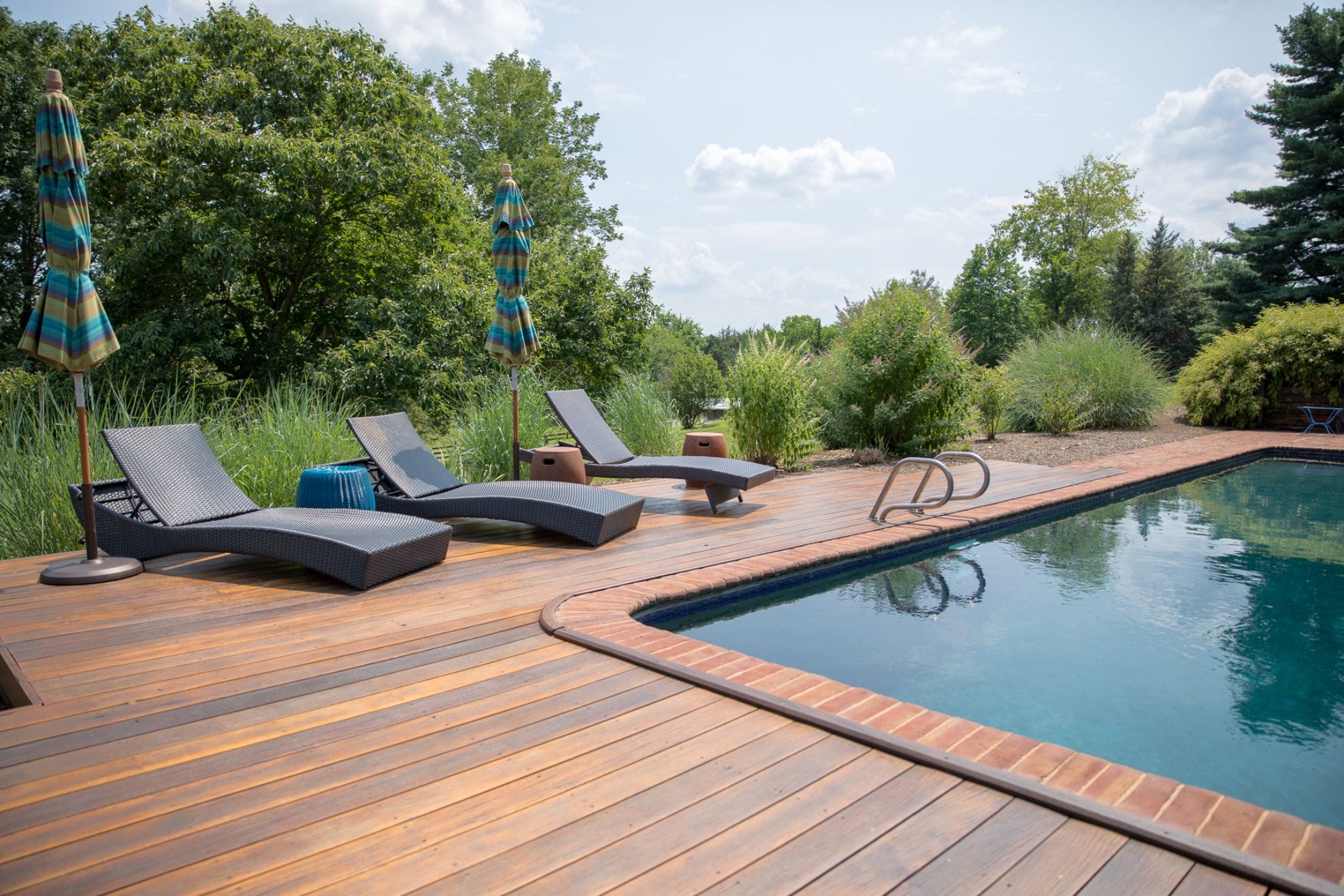 Poolside lounge chairs and umbrellas.