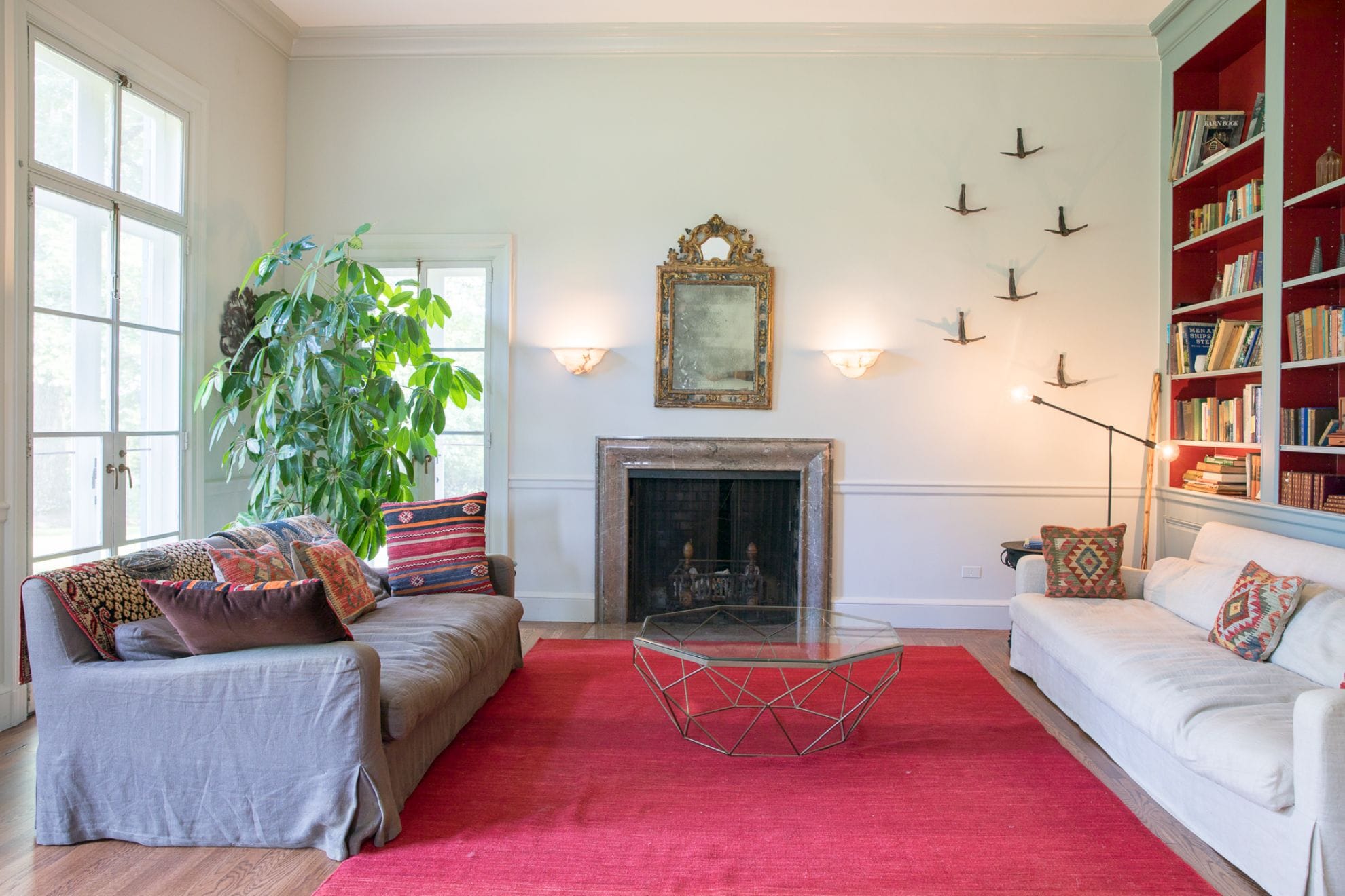 Living room with fireplace, couches.