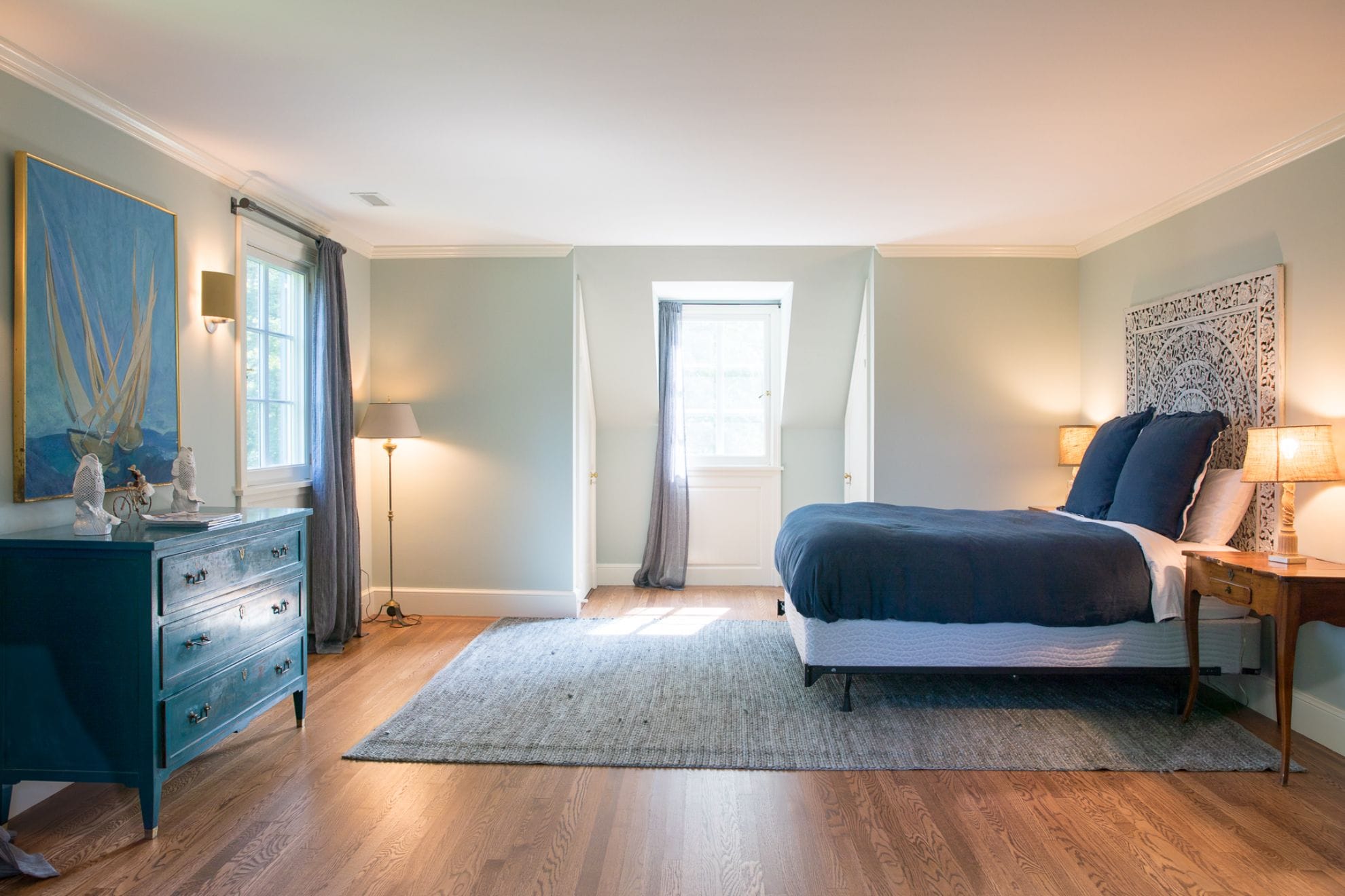 Bedroom with wooden floor, window.