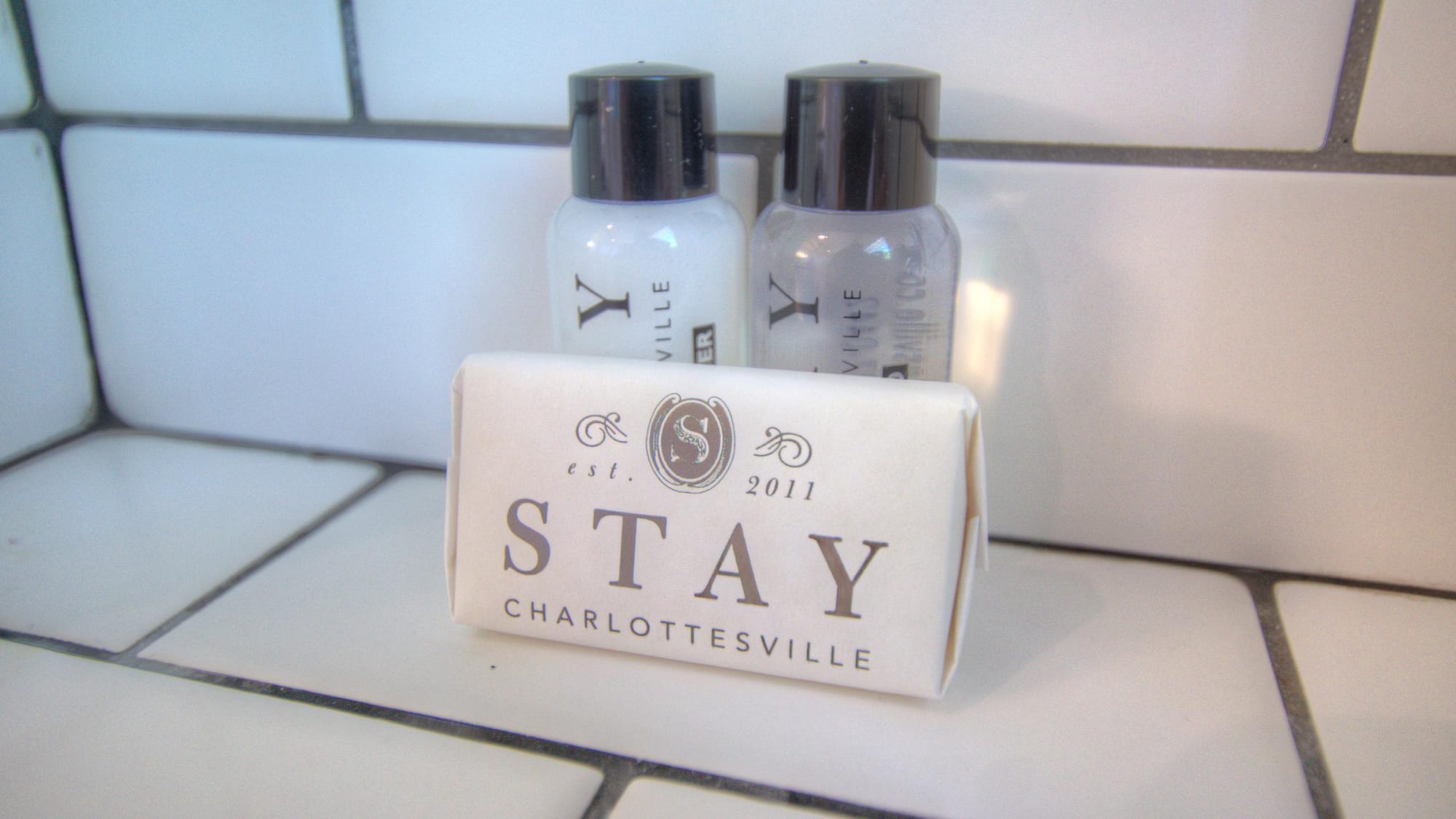 Stay Charlottesville toiletries on tiles.