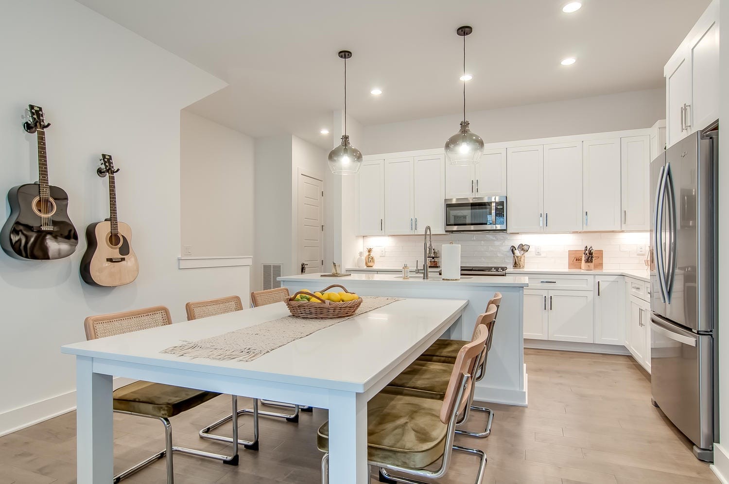 Modern kitchen with dining table.