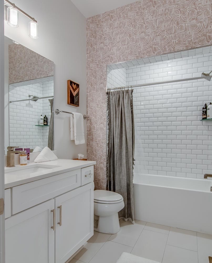 Modern bathroom with white tiles.