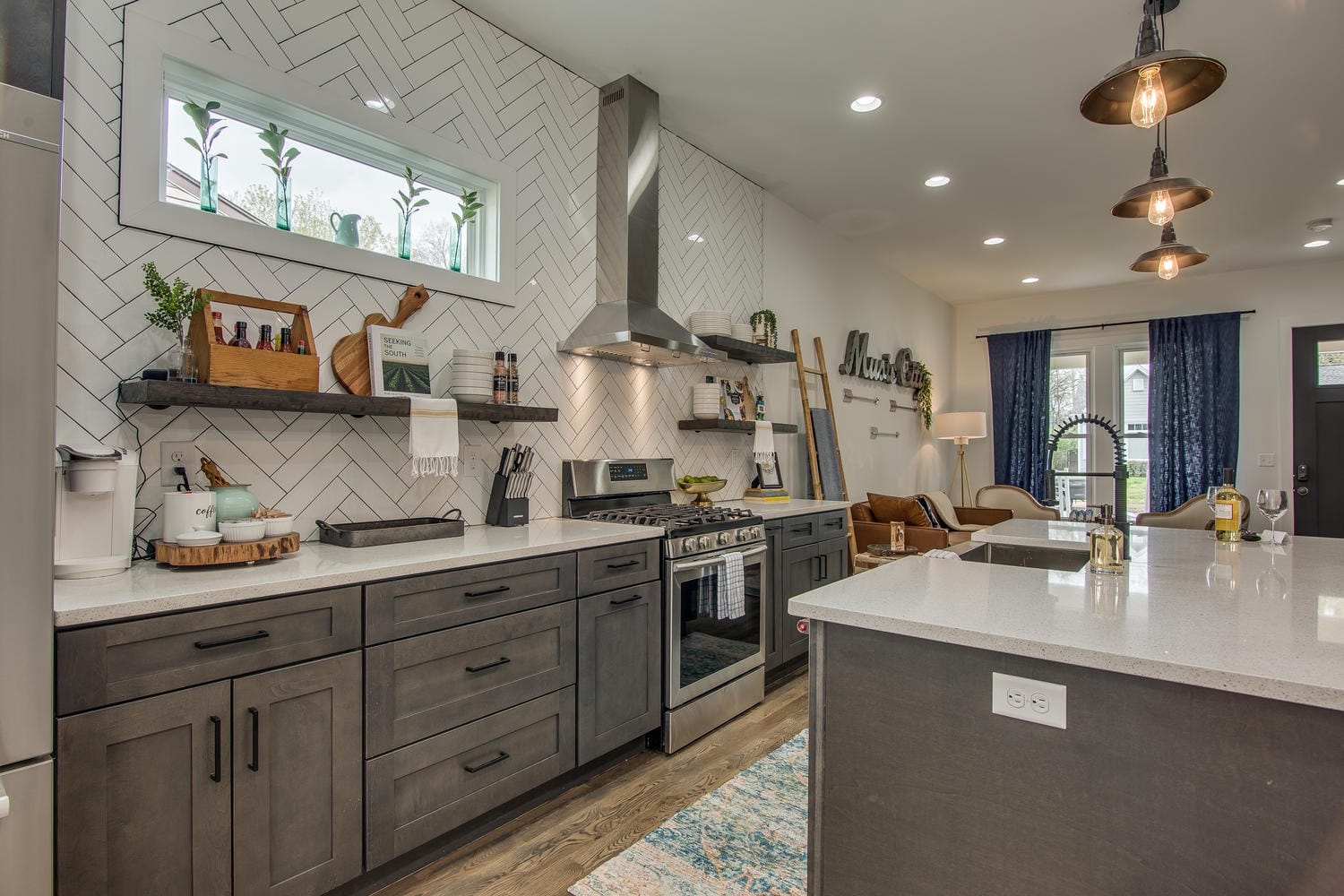 Modern kitchen with dark cabinetry.