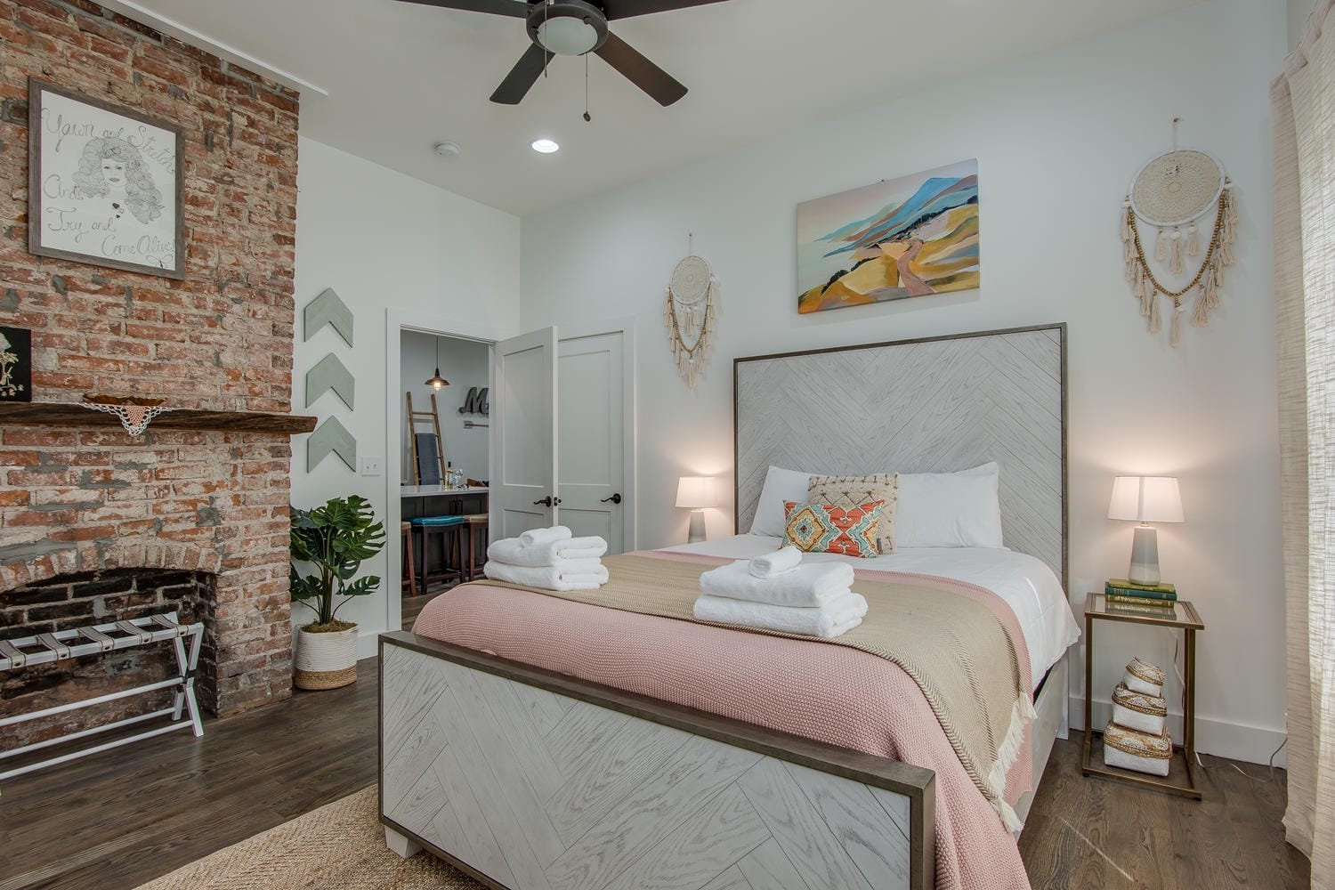 Cozy bedroom with brick fireplace.