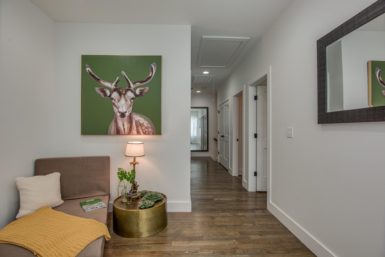 Modern hallway with deer painting.