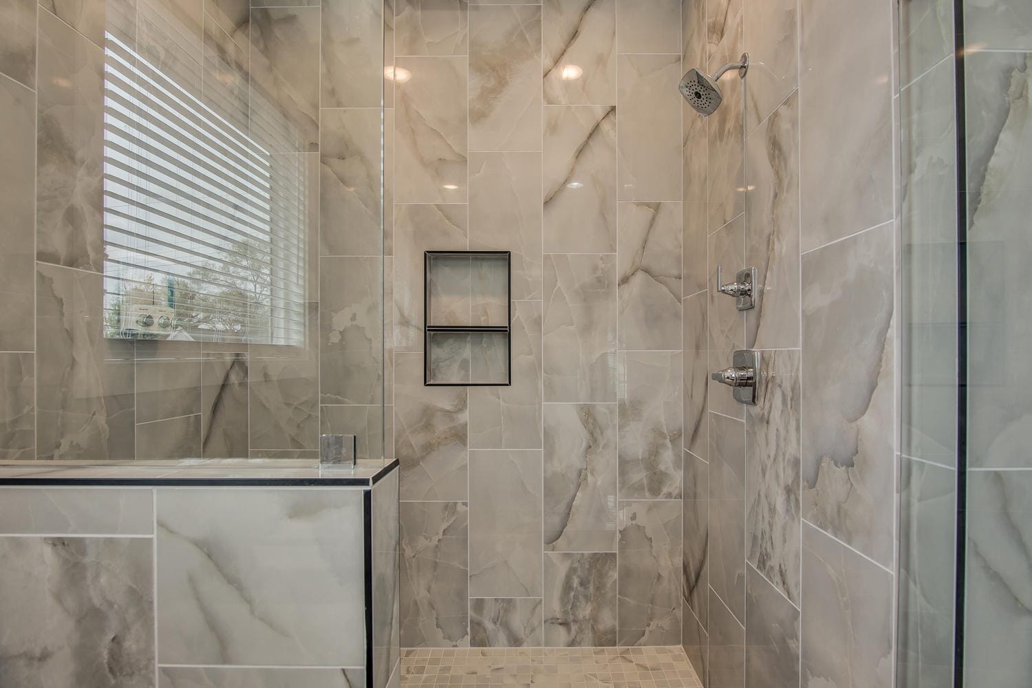 Marble shower with glass door