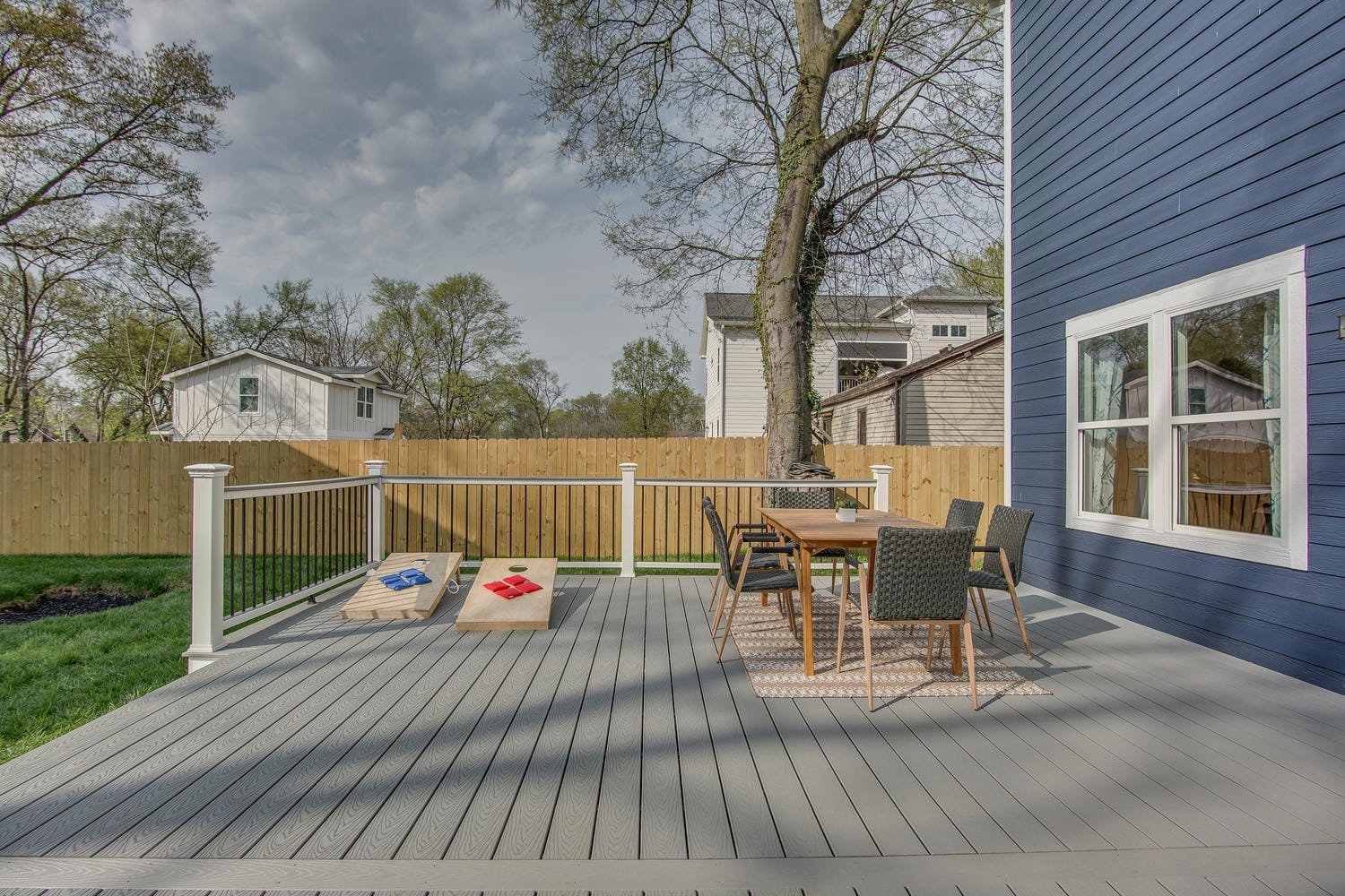 Backyard deck with furniture dining.