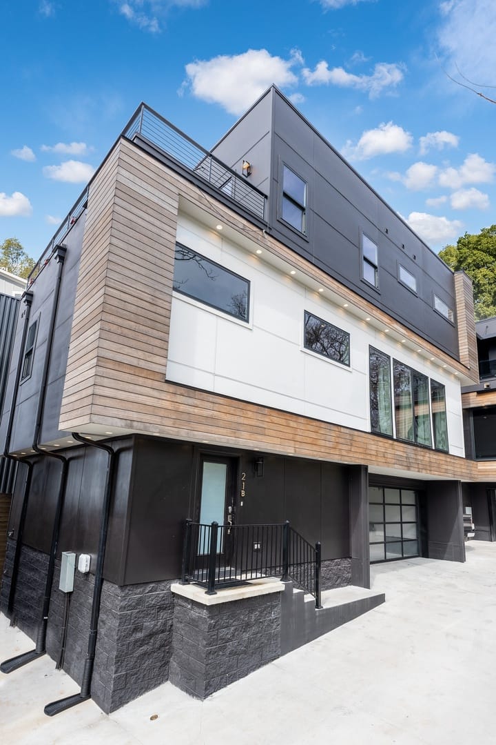 Modern multi-story black house exterior.