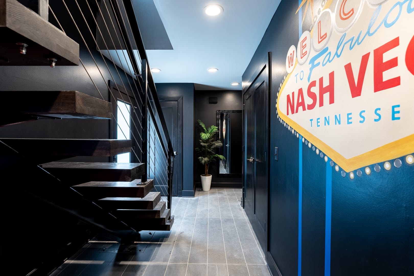 Modern black staircase and hallway.