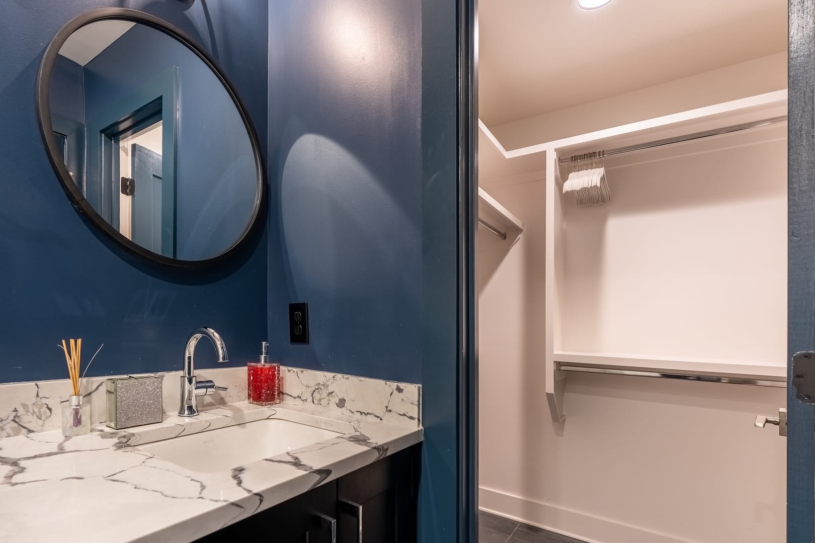 Bathroom and closet with mirror.