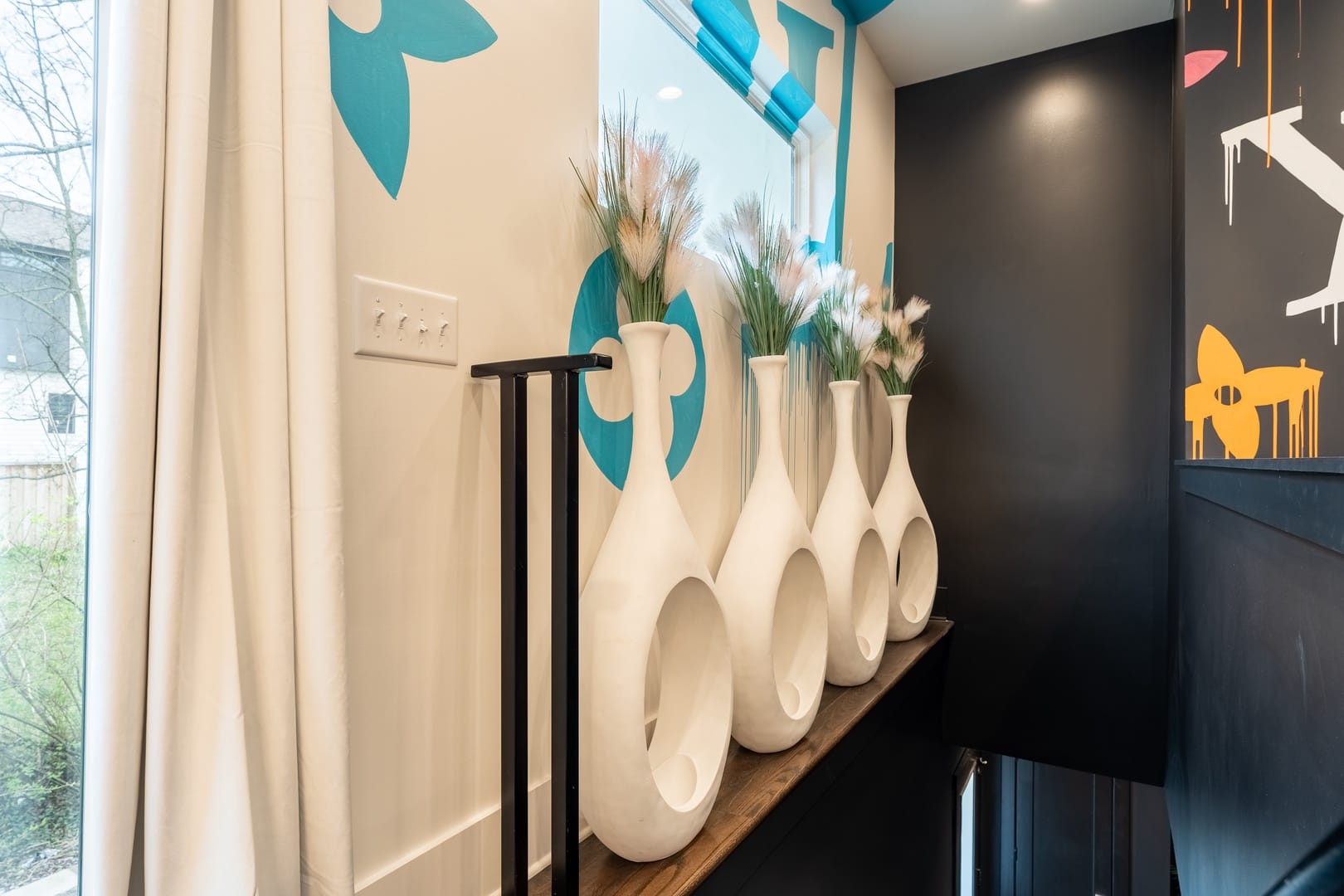 White vases with pampas grass.