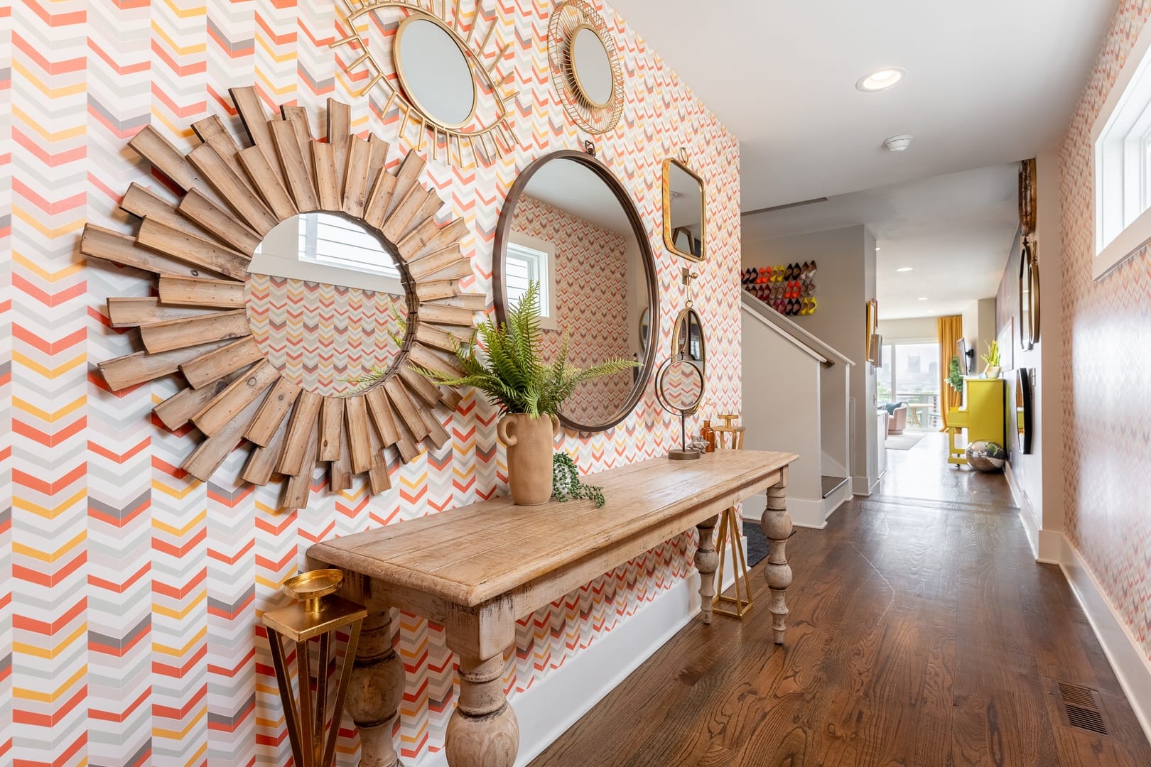 Colorful hallway with decorative mirrors.