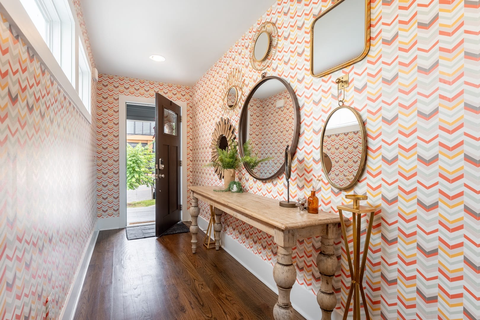 Colorful hallway with decorative mirrors.