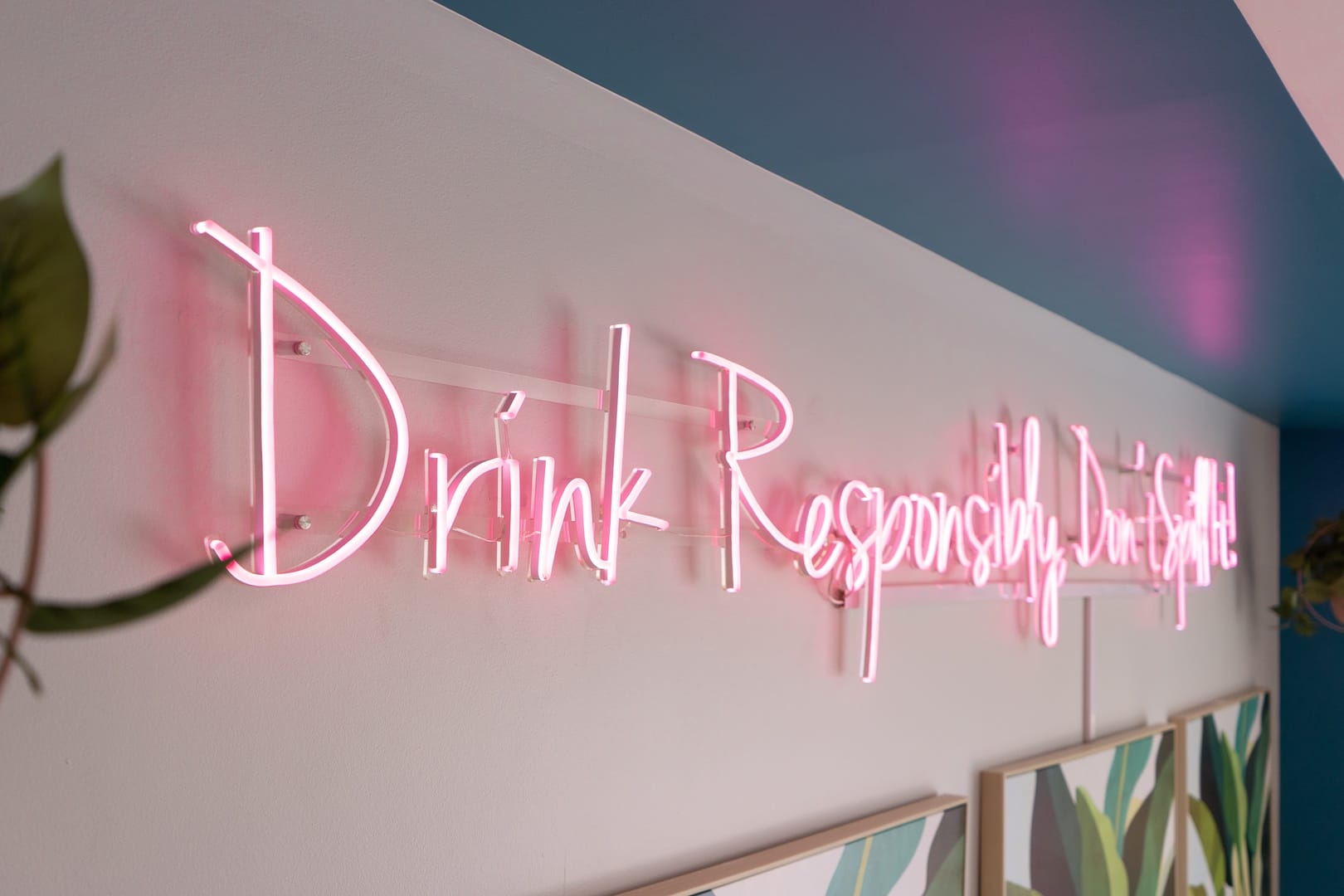 Pink neon sign, "Drink Responsibly".