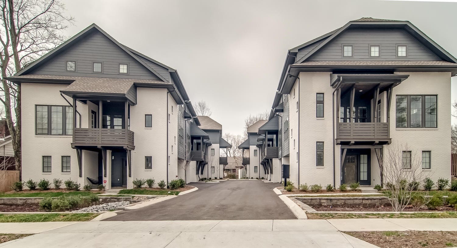 Modern duplex homes with balconies.