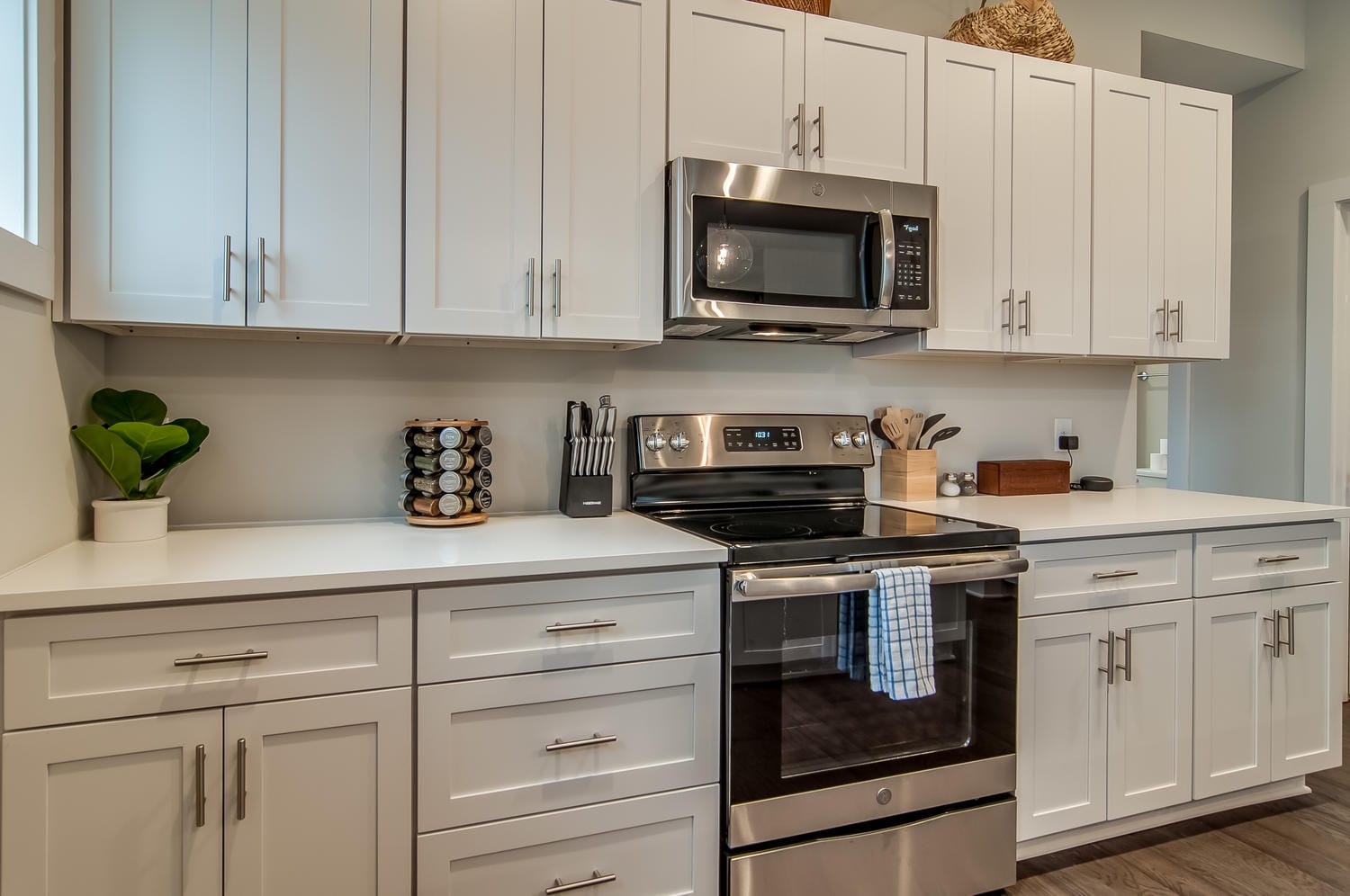 Modern kitchen with white cabinets.