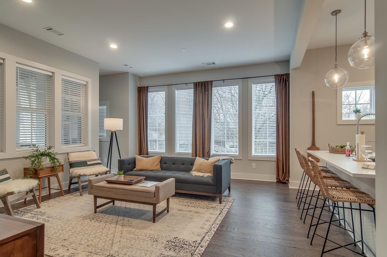 Modern living room with large windows.