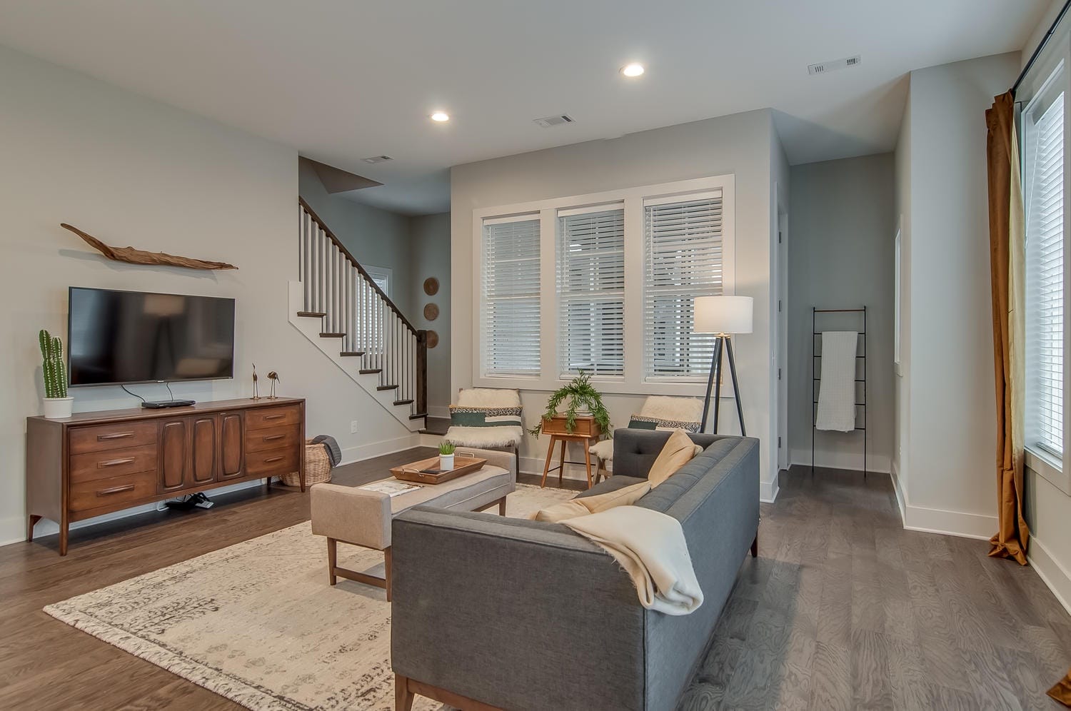 Modern living room with staircase.