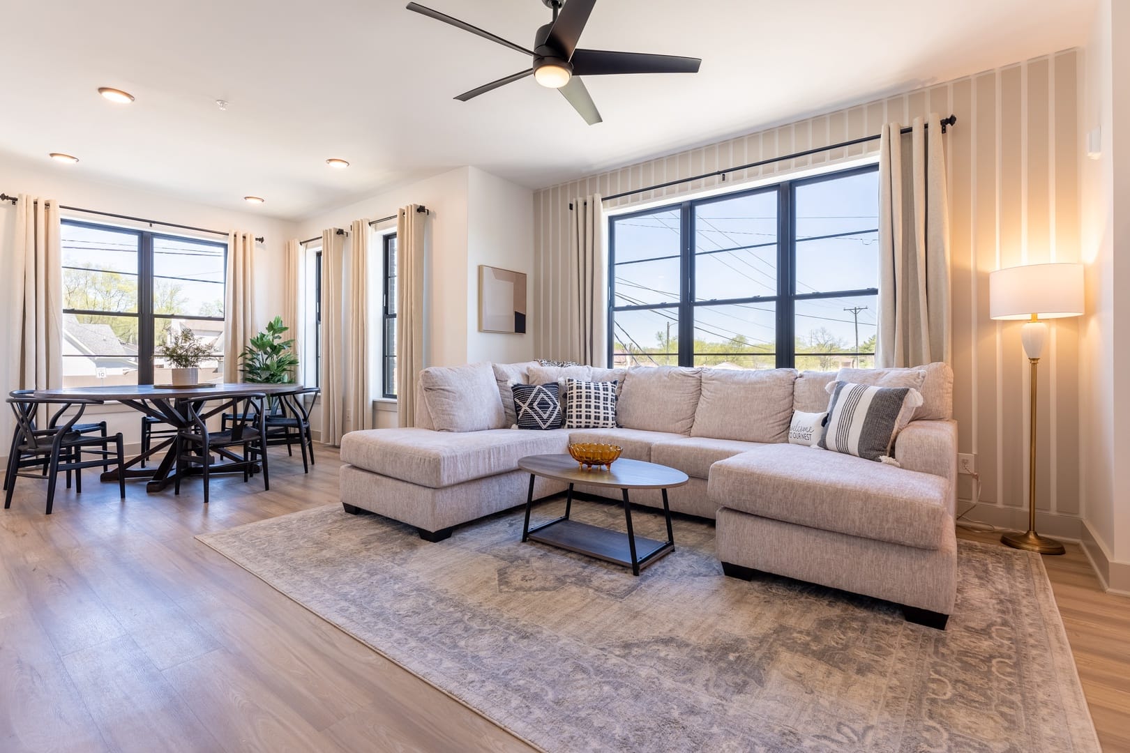 Modern living room with large windows.