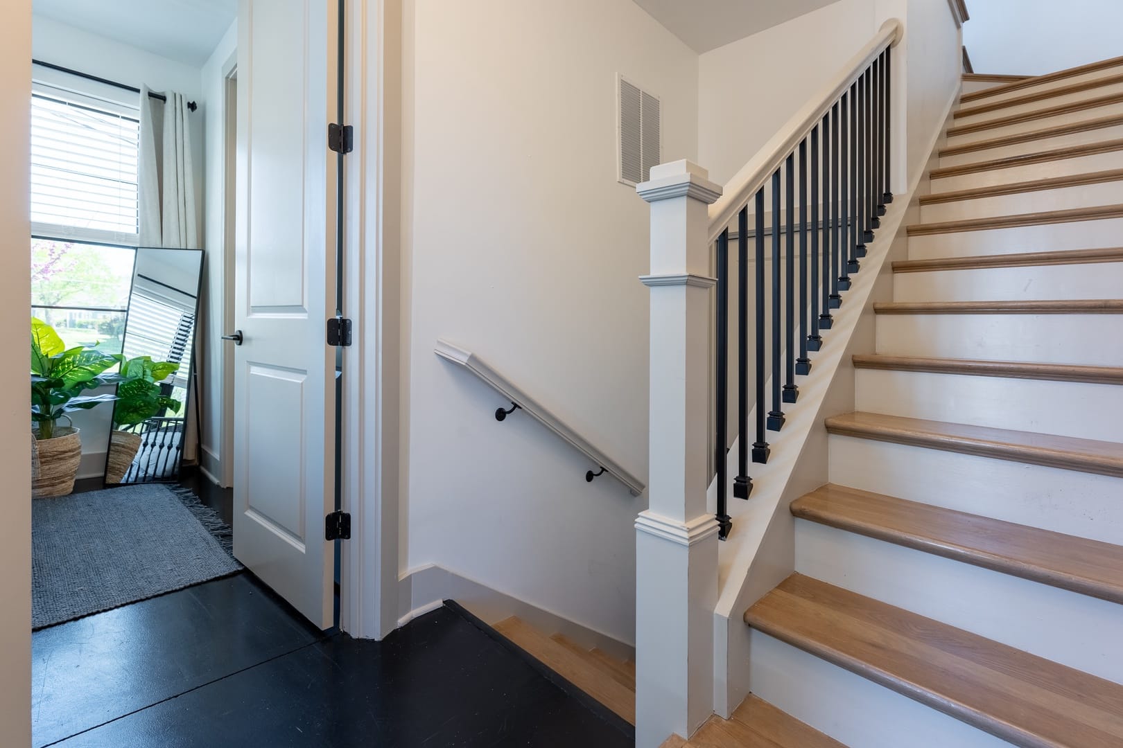 Staircase with adjacent room entrance.