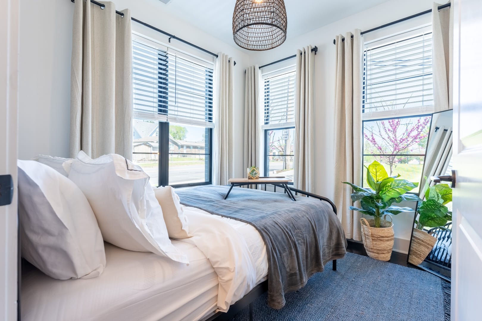 Bright bedroom with large windows.