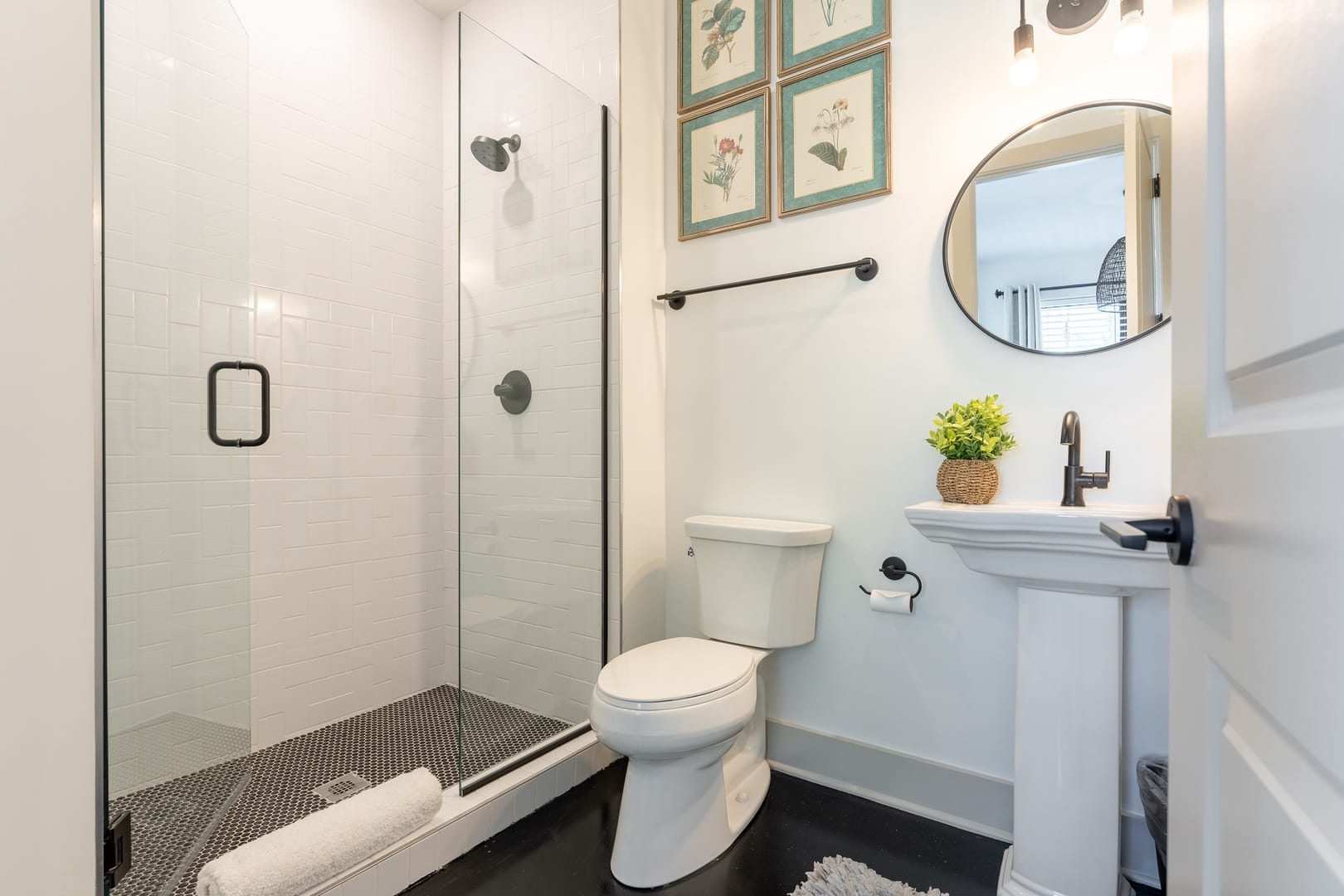 Modern bathroom with shower and toilet.