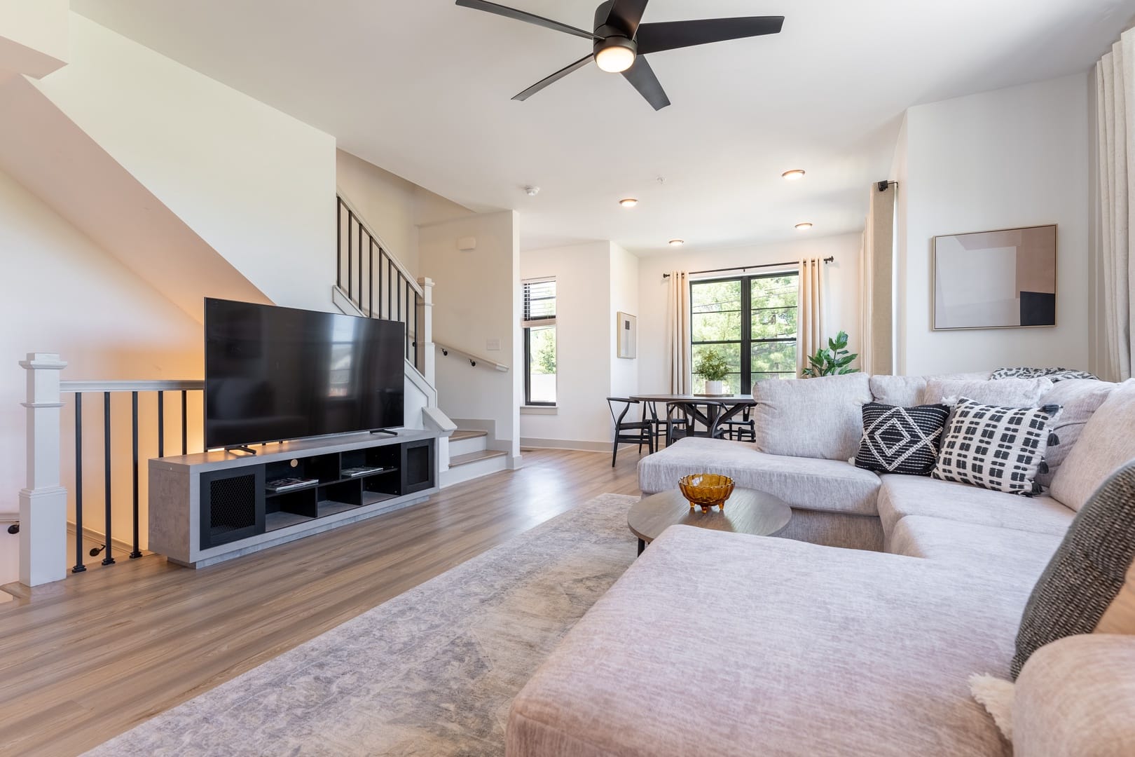 Modern living room with staircase.