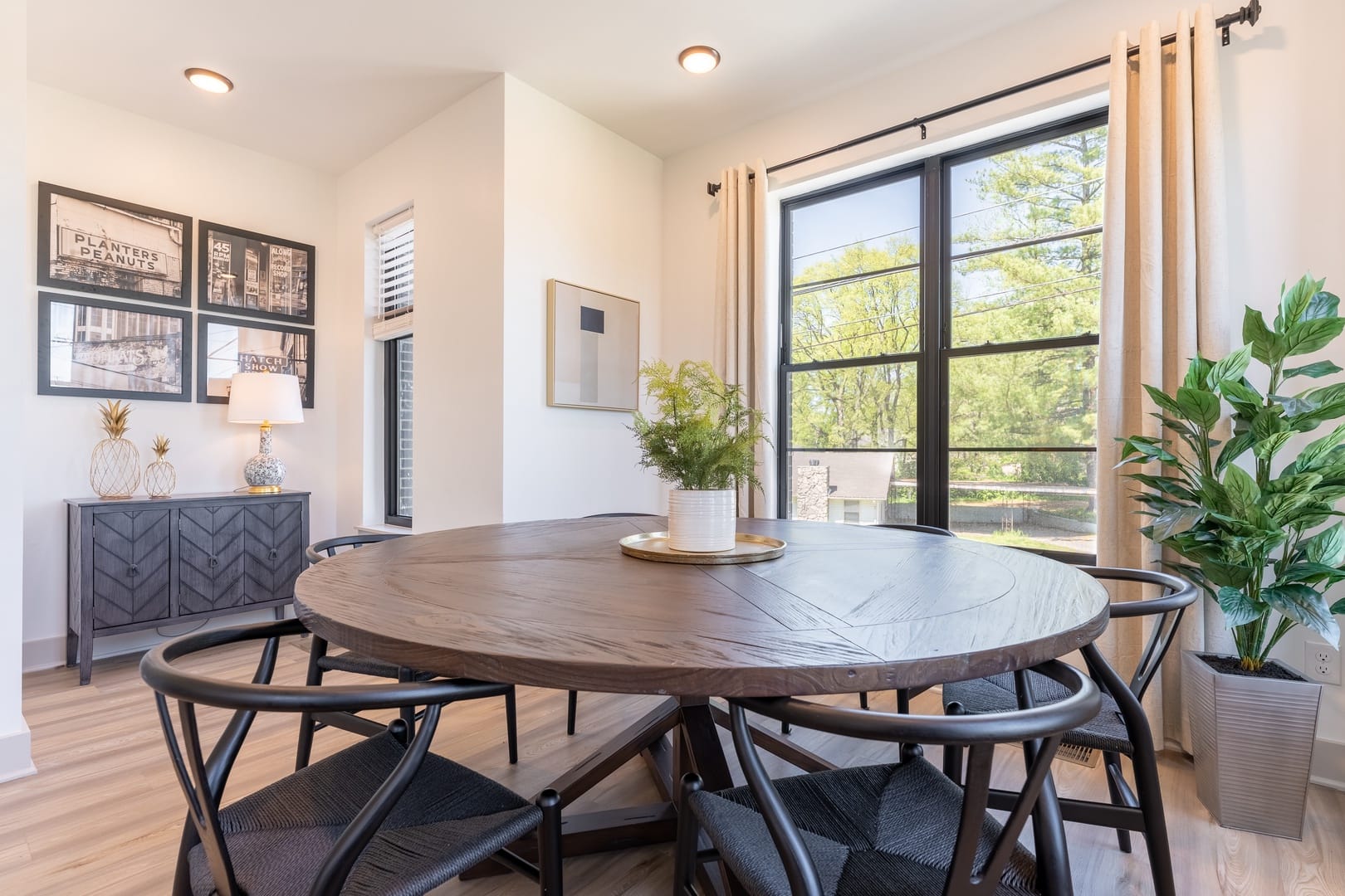 Modern dining room with large window.