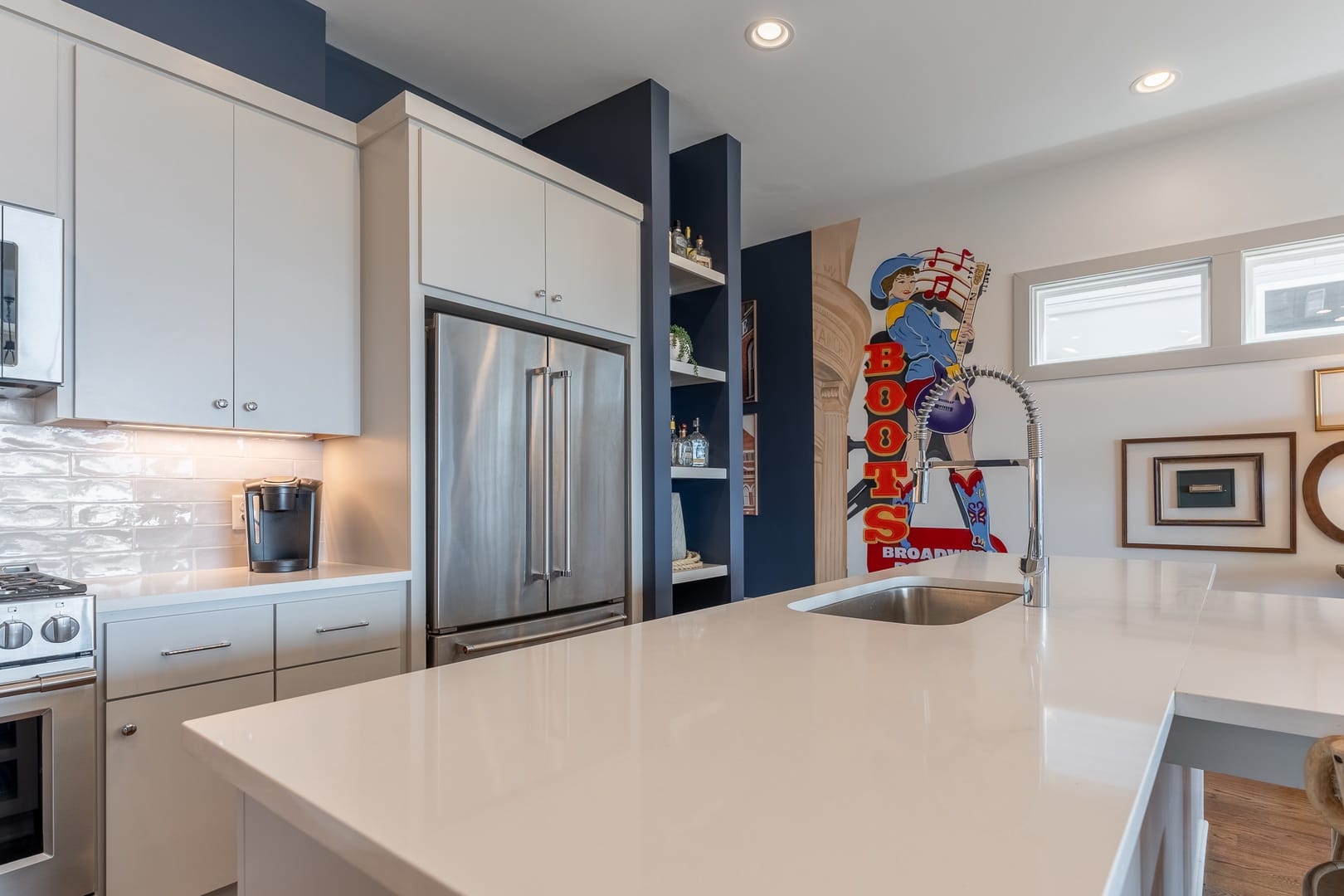 Modern kitchen with cowboy mural.