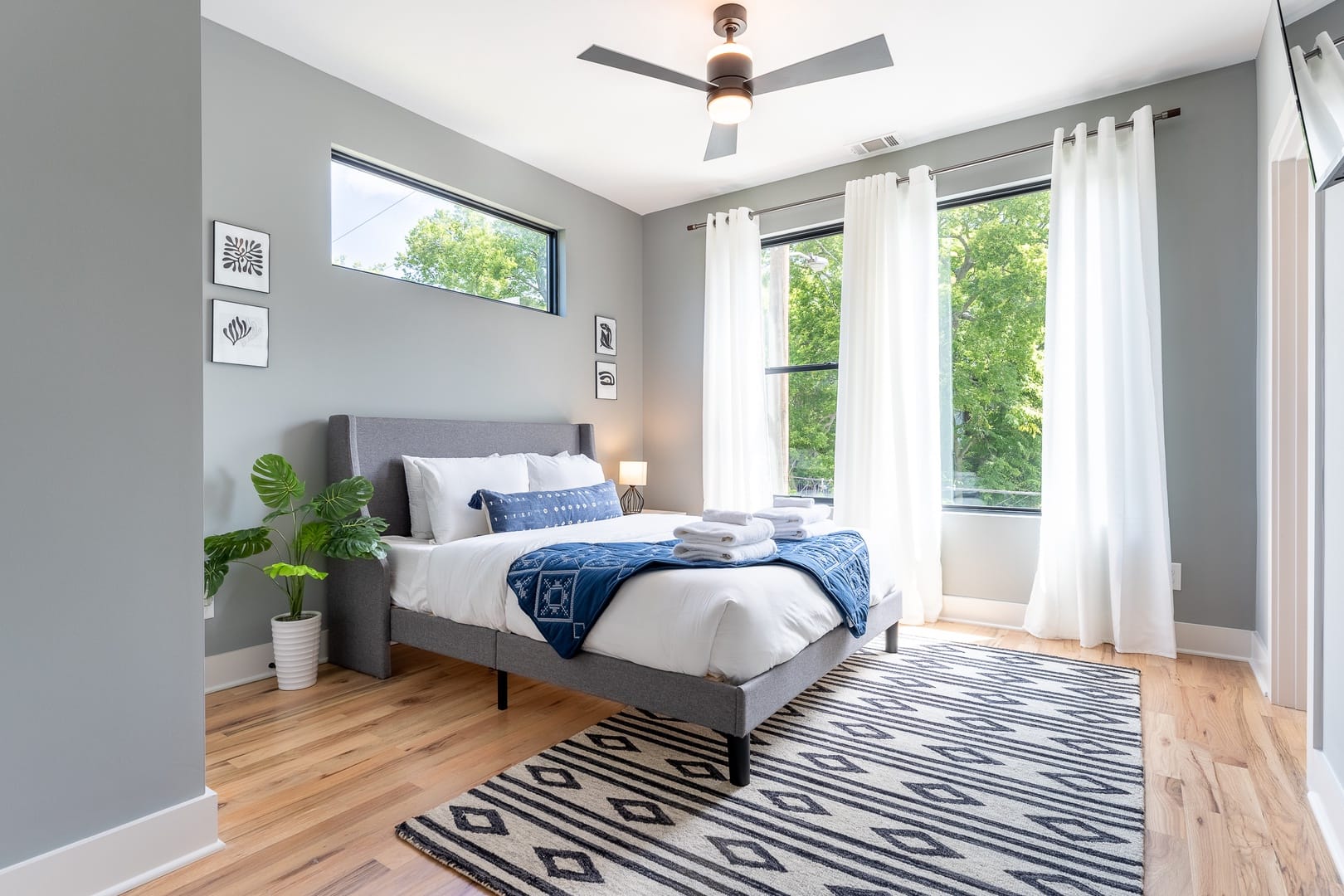 Bright bedroom with large windows.