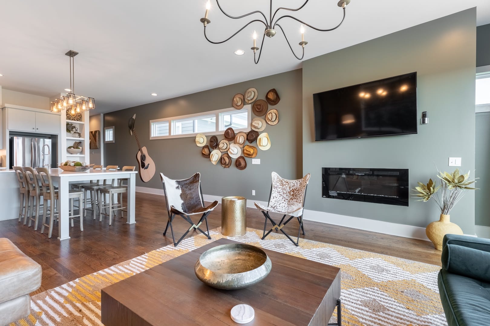 Modern living room with kitchen area.