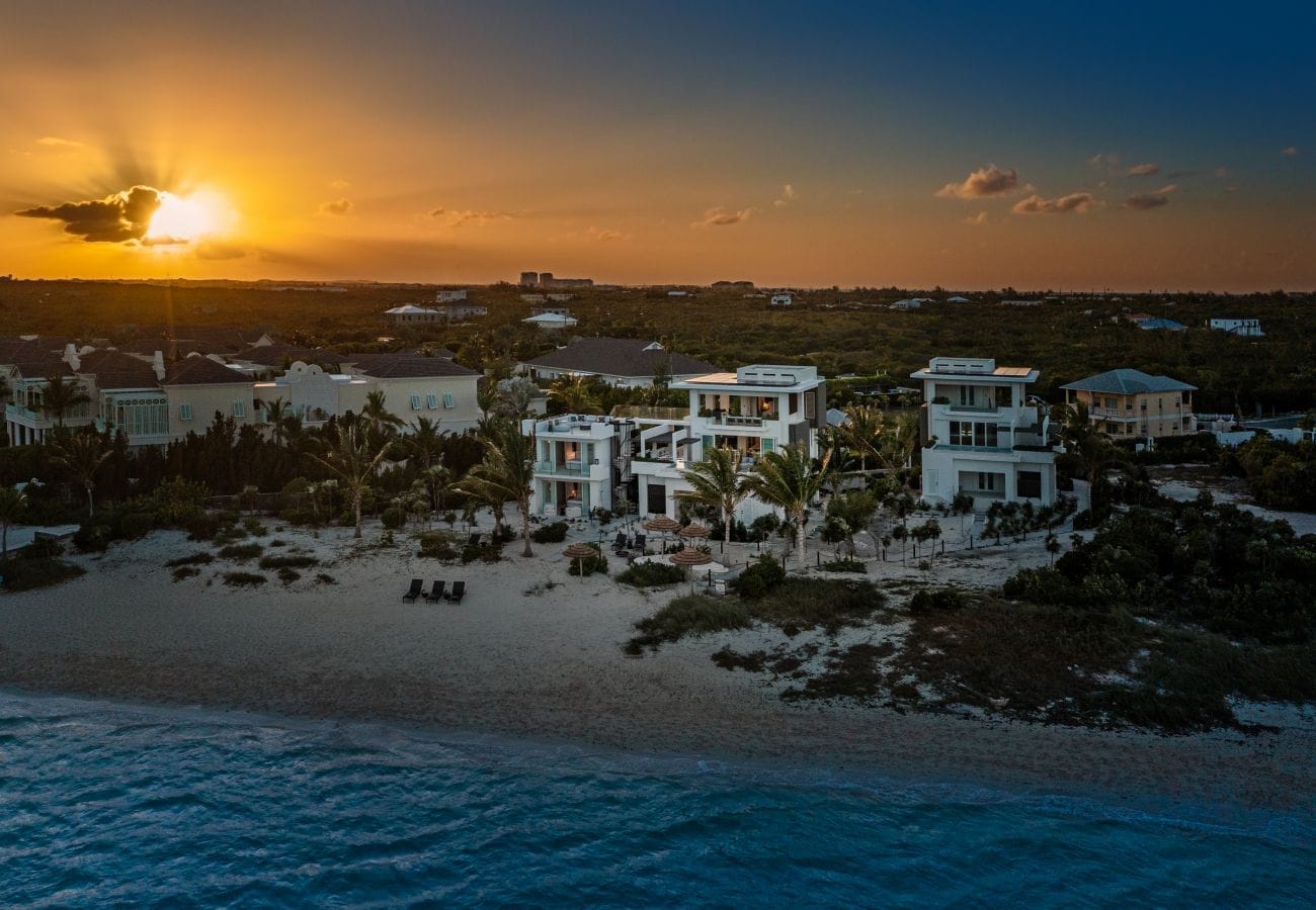 Beachfront houses at sunset.