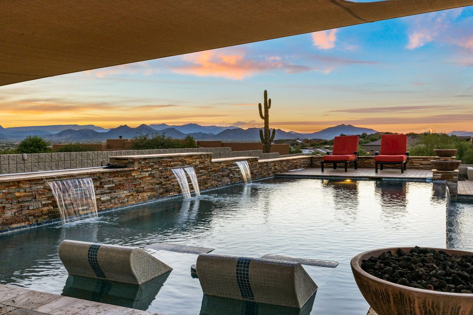 Poolside with desert mountain view.