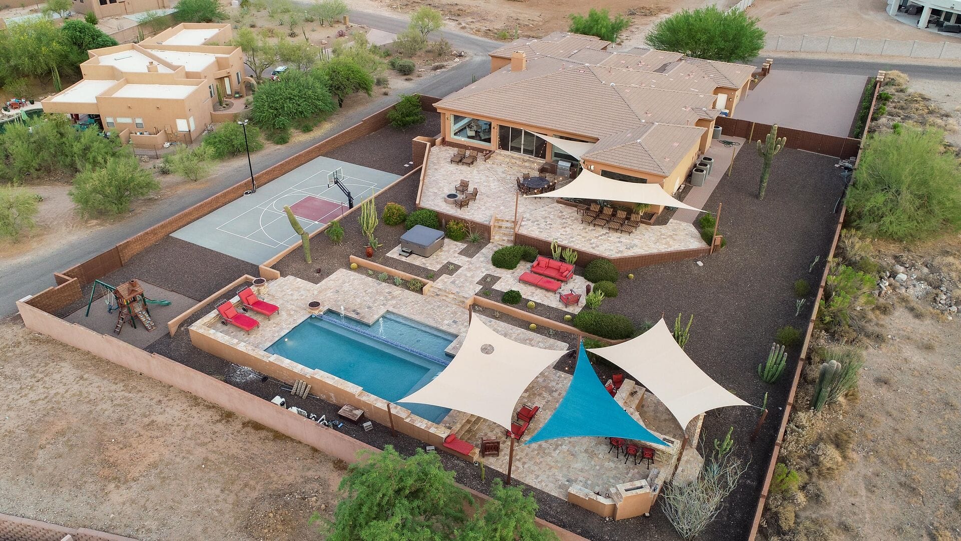 Desert home with pool and patio.