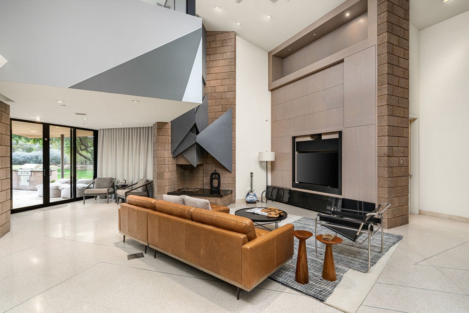 Modern living room with abstract fireplace.