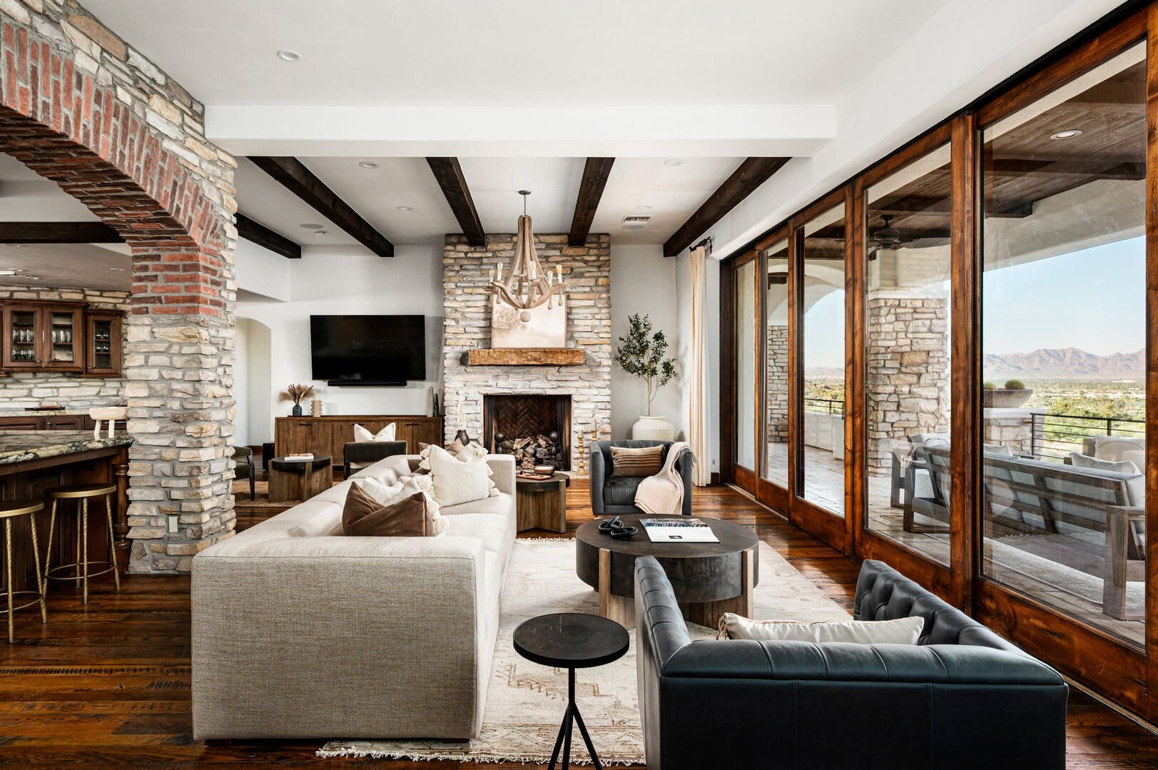 Rustic living room with stone fireplace.