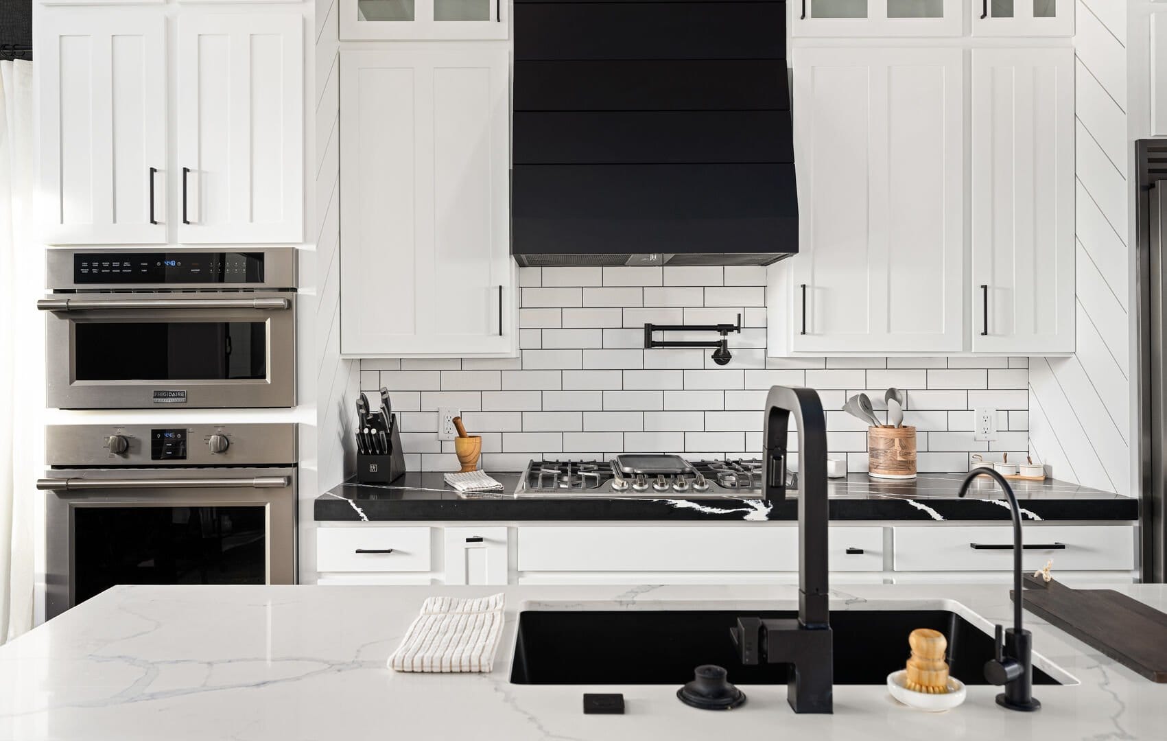 Modern kitchen with black accents.