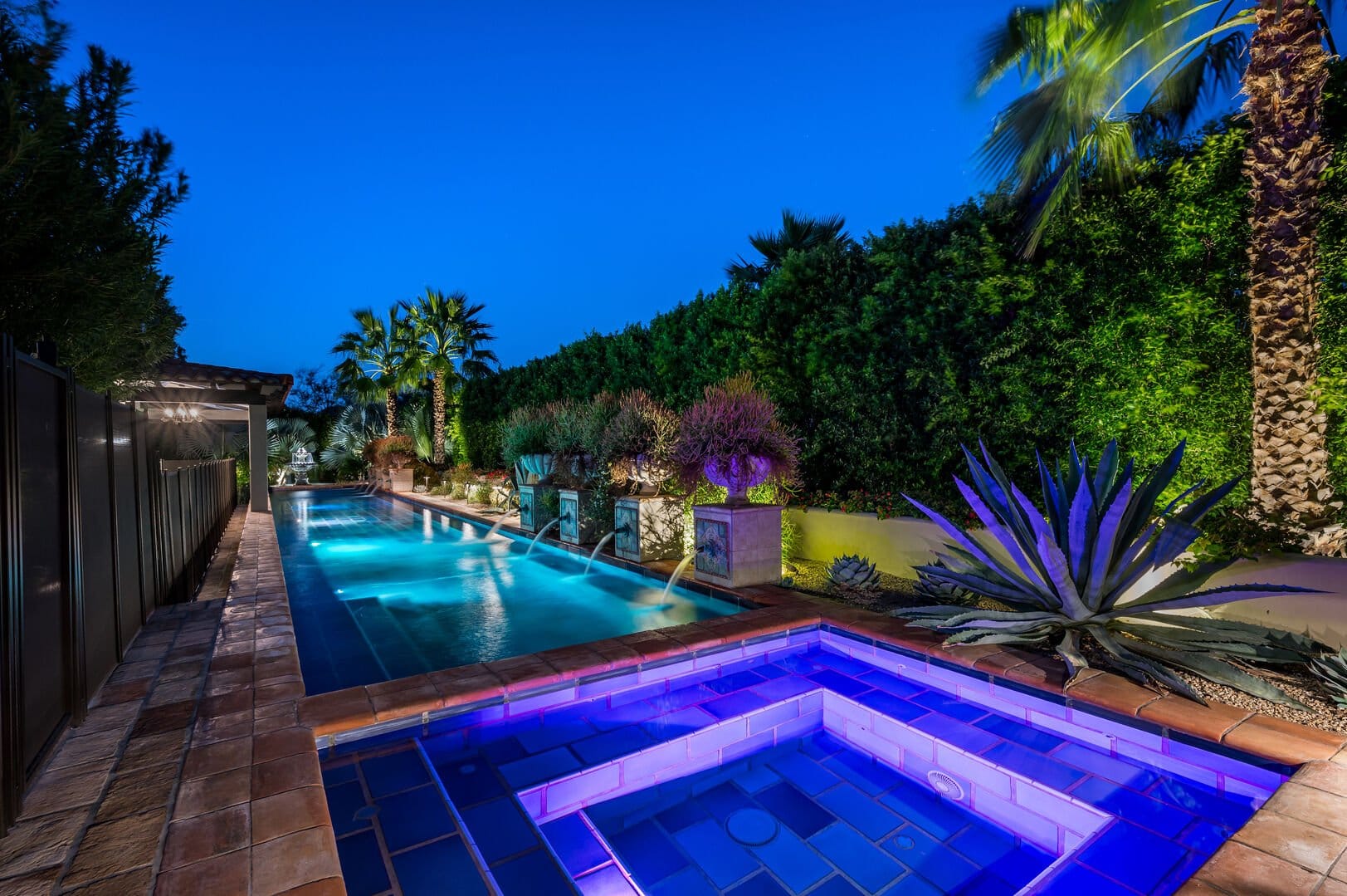 Nighttime pool and hot tub area.