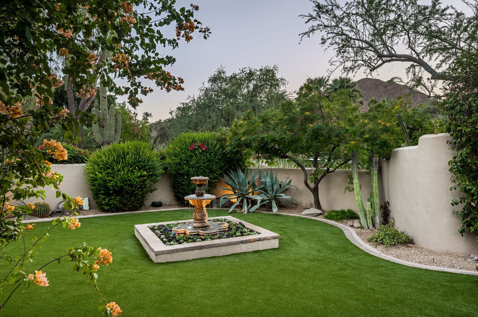 Garden with fountain and plants.