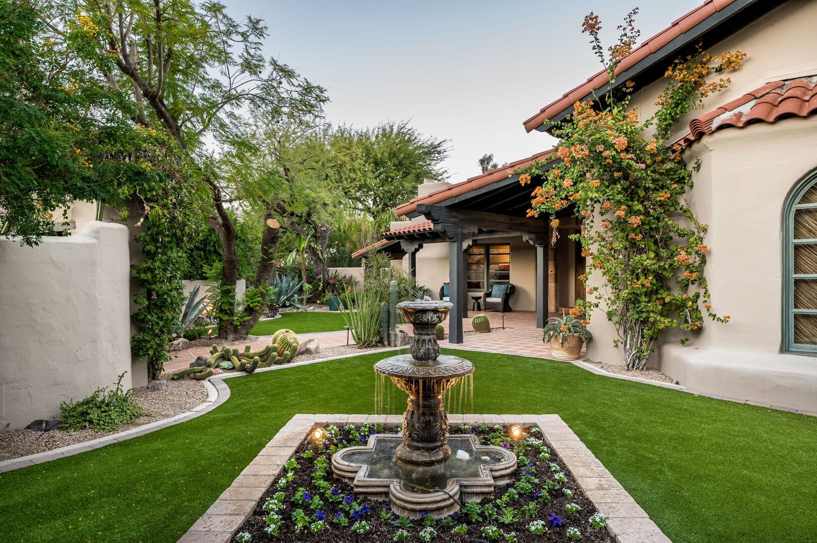 Lush courtyard with central fountain.