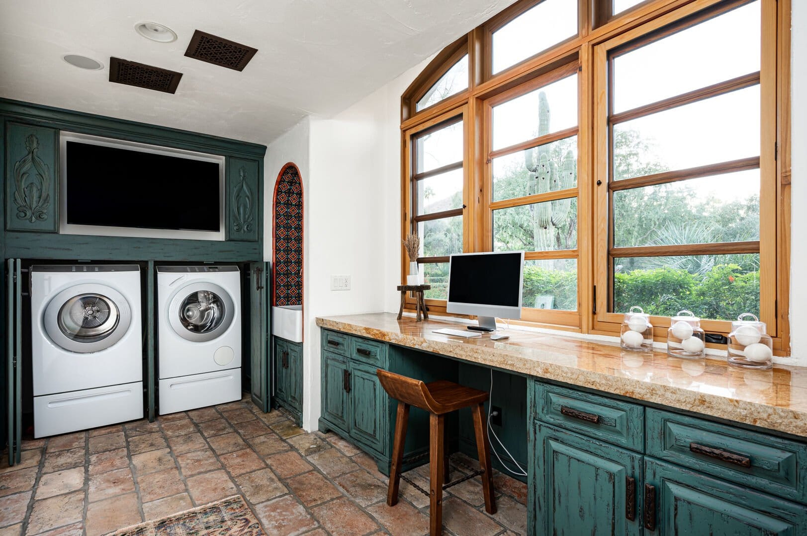 Laundry room office combo setup.