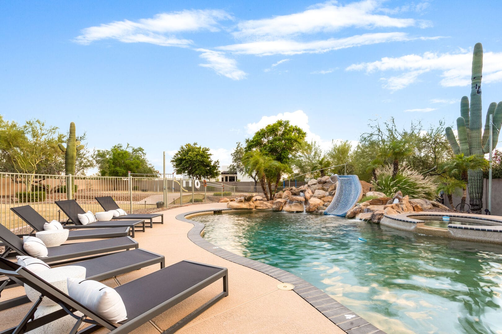 Desert pool with lounge chairs.