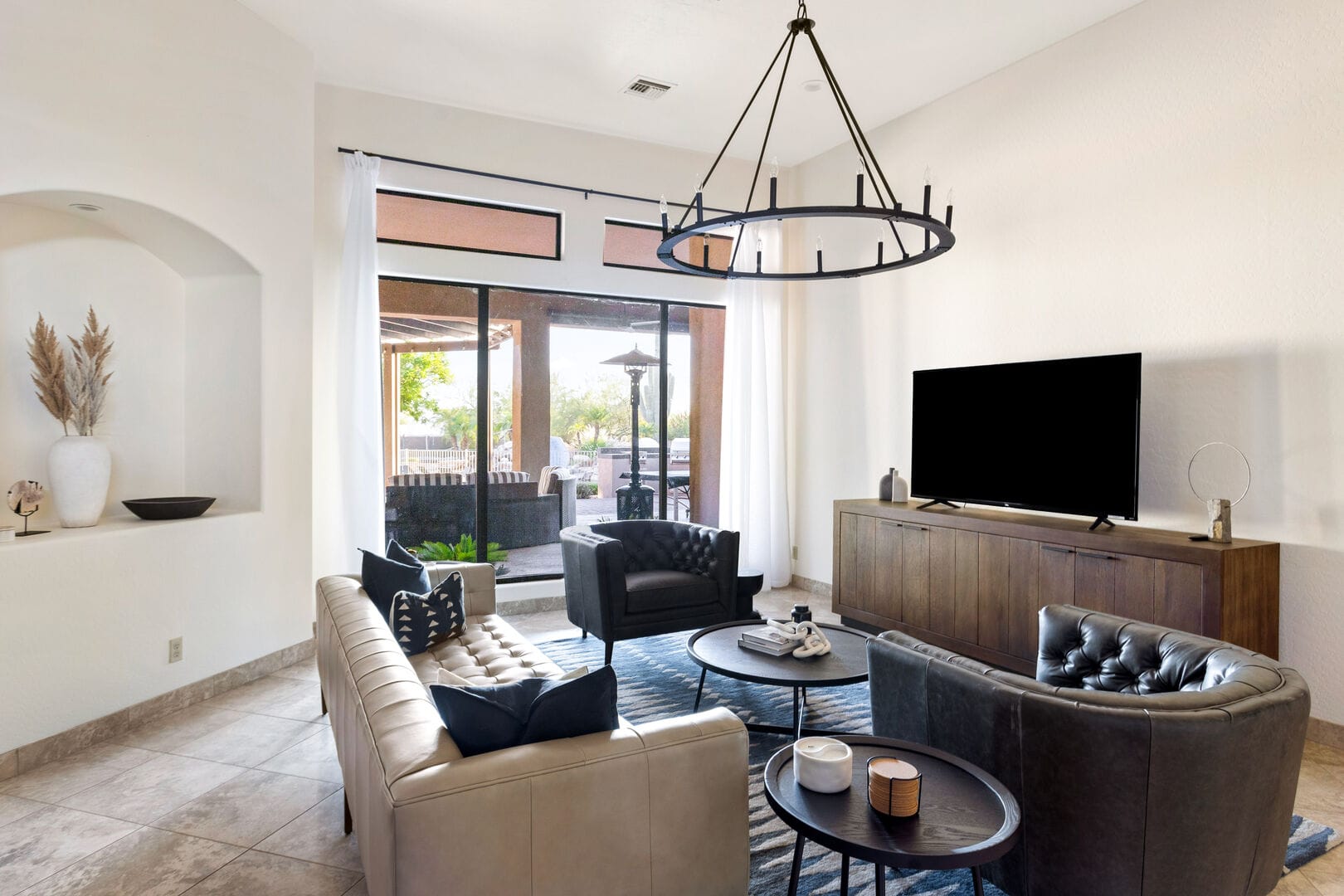 Modern living room with large windows.