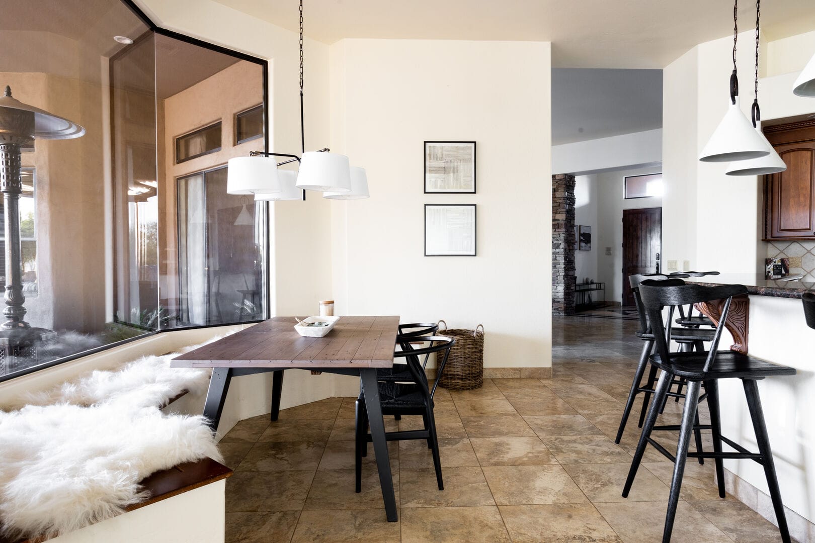 Modern dining area with large window.