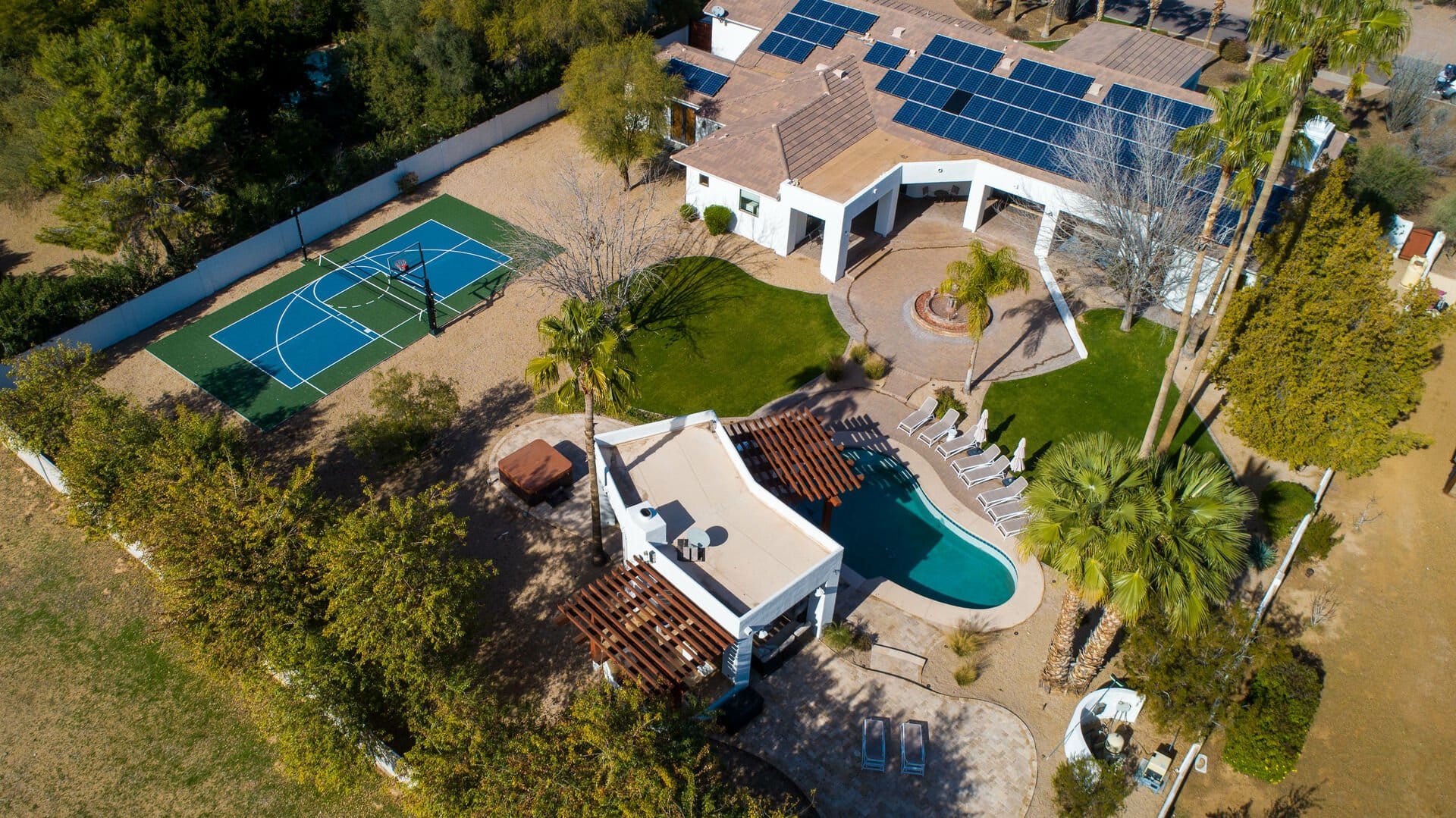 House with pool and basketball court.