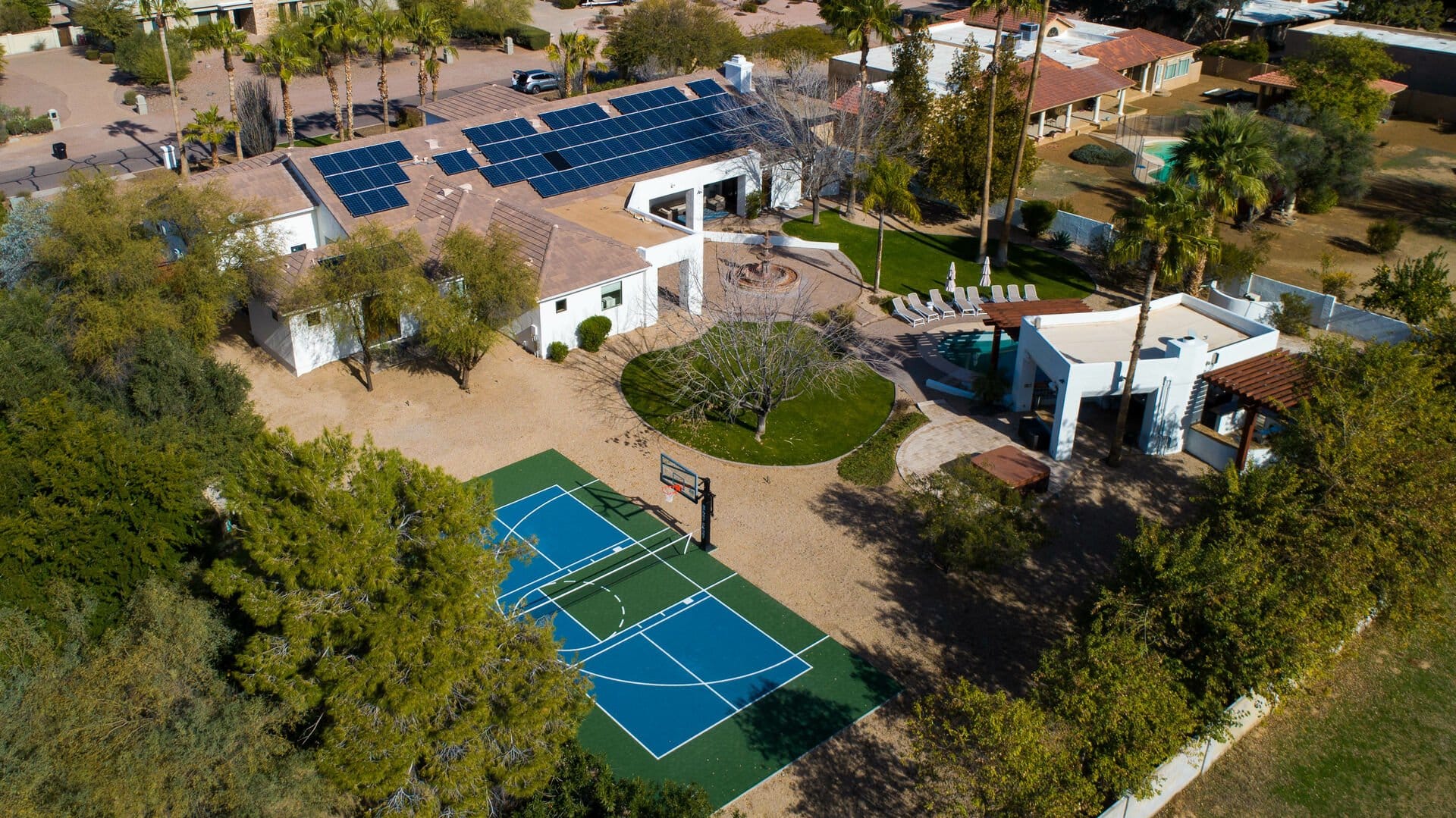 House with pool and basketball court.