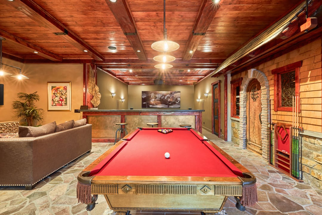 Rustic game room with pool table.