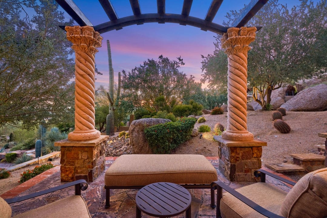 Desert patio with columns at sunset.