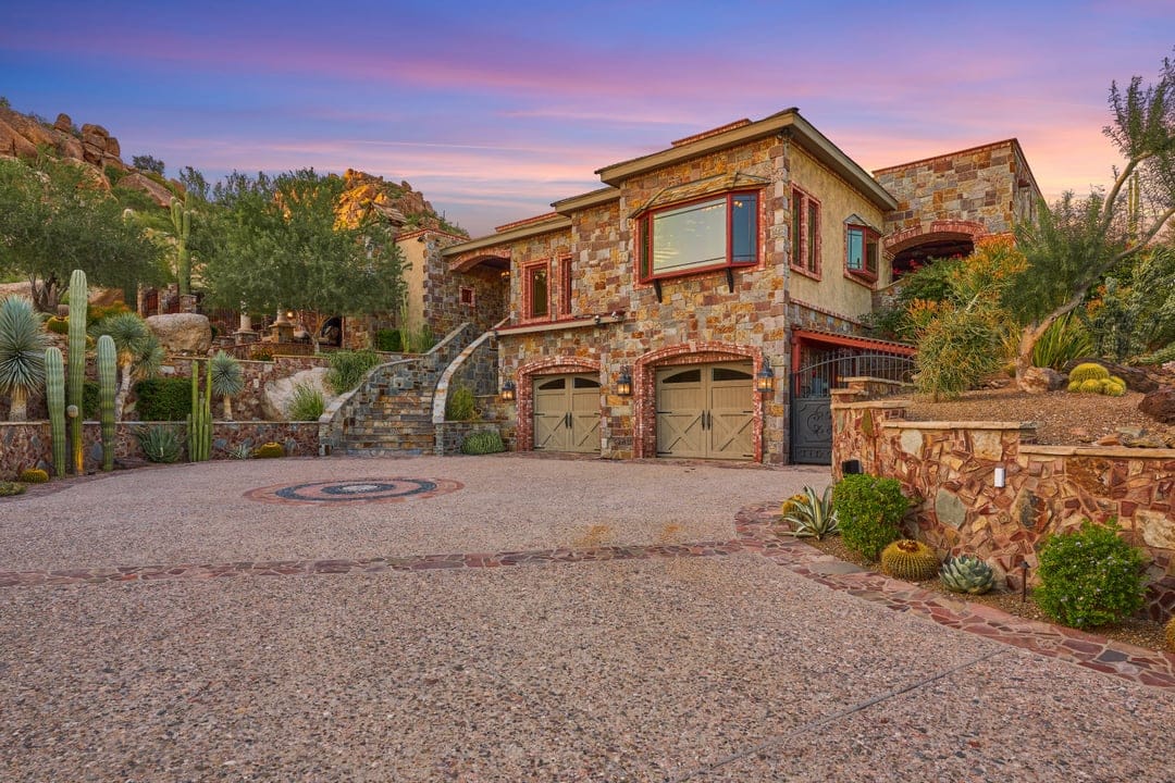 Stone house with cactus landscaping.