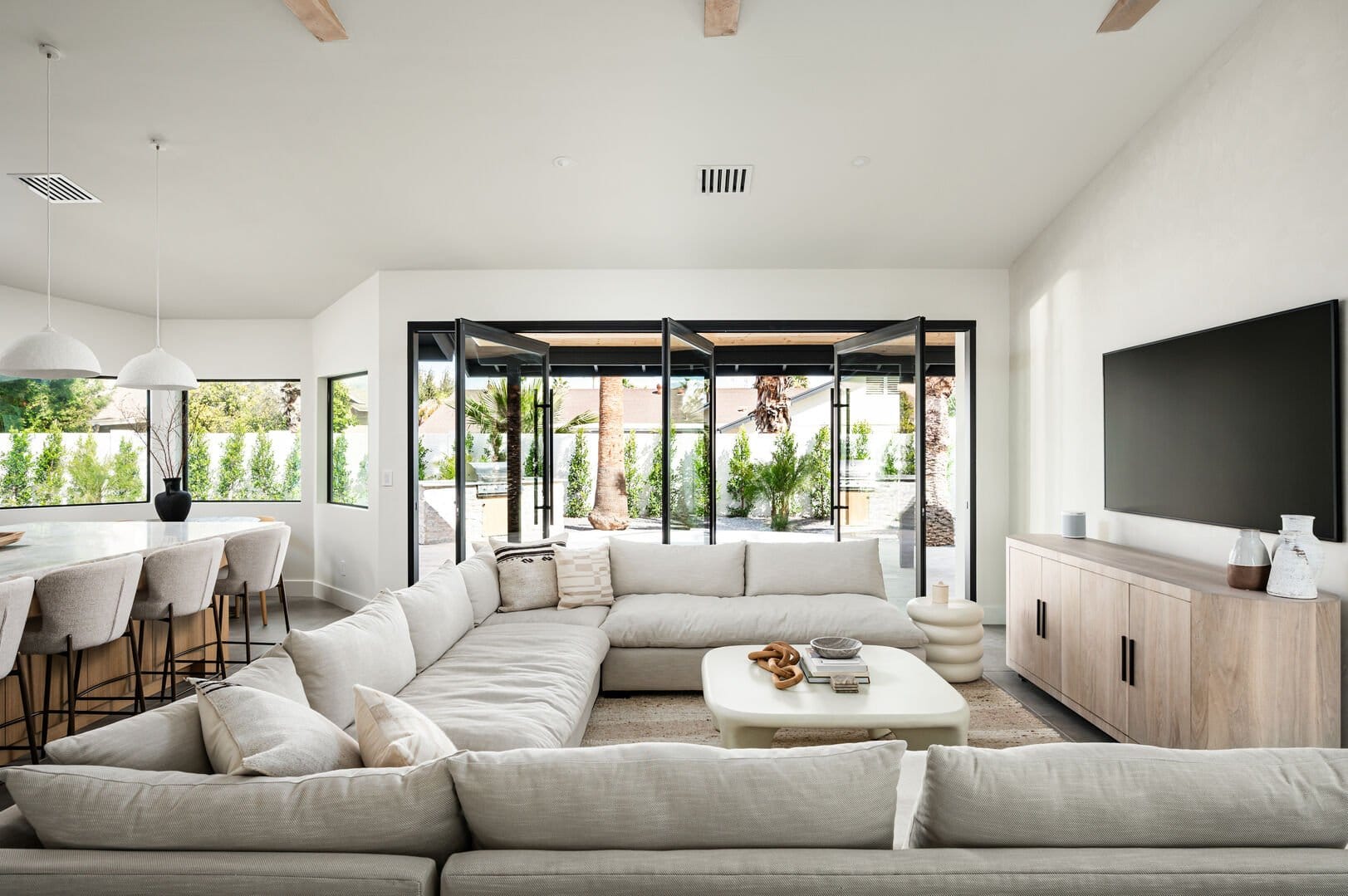 Modern living room with large windows.